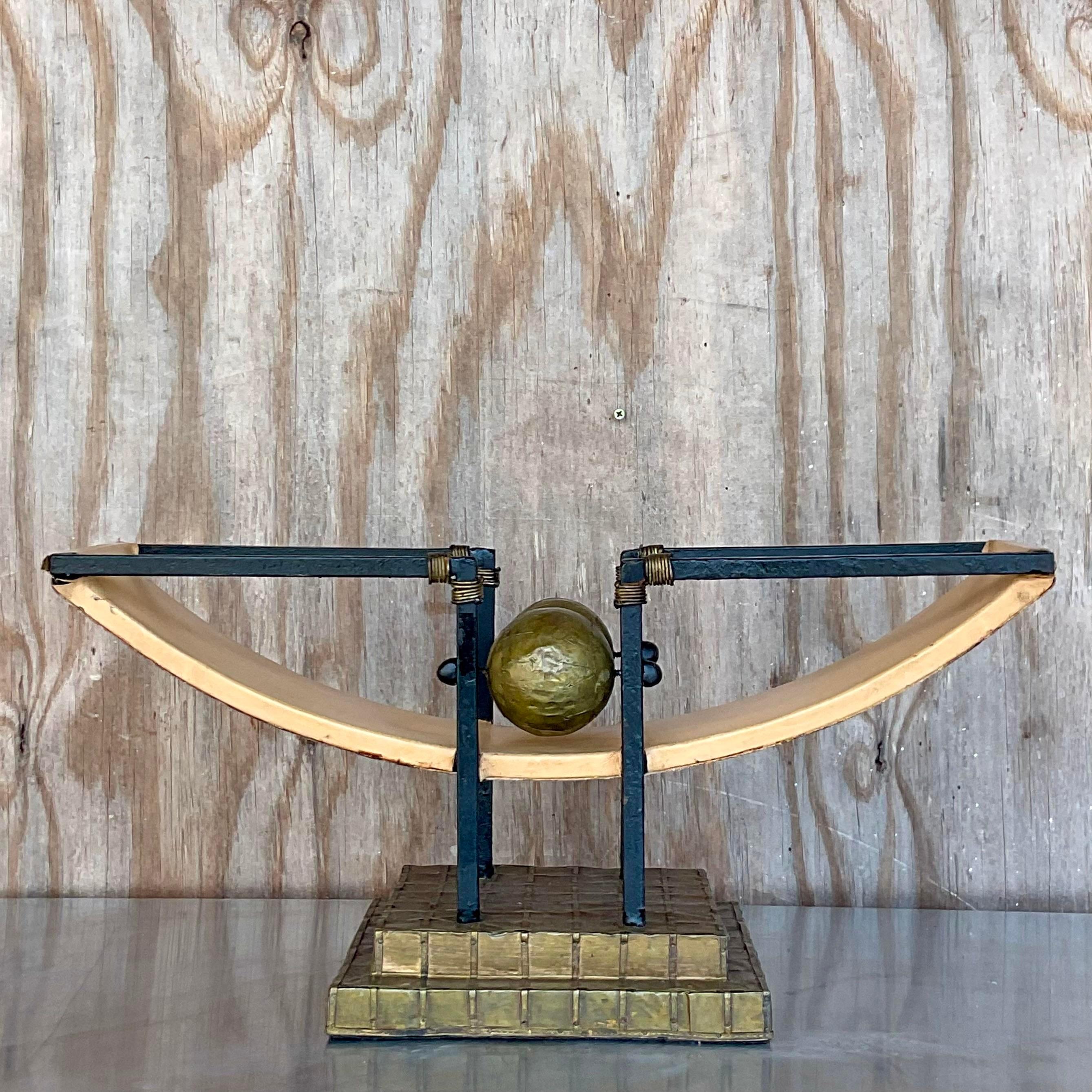 Fabulous vintage Postmodern sculpture. A chic combination of wrought iron, leather and hammered brass. A textural symphony! Acquired from a Palm Beach estate.