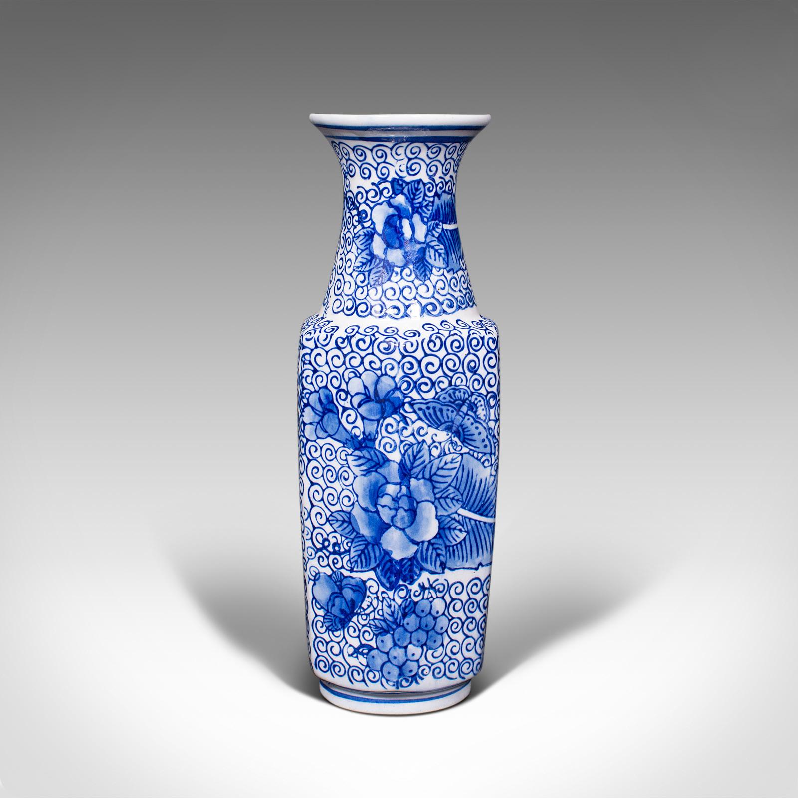 This is a vintage posy vase. A Japanese, ceramic flower baluster in the manner of Delft from the late Art Deco period, dating to the mid 20th century, circa 1940.

Decorated with rich colour and of appealing slender proportion
Displays a