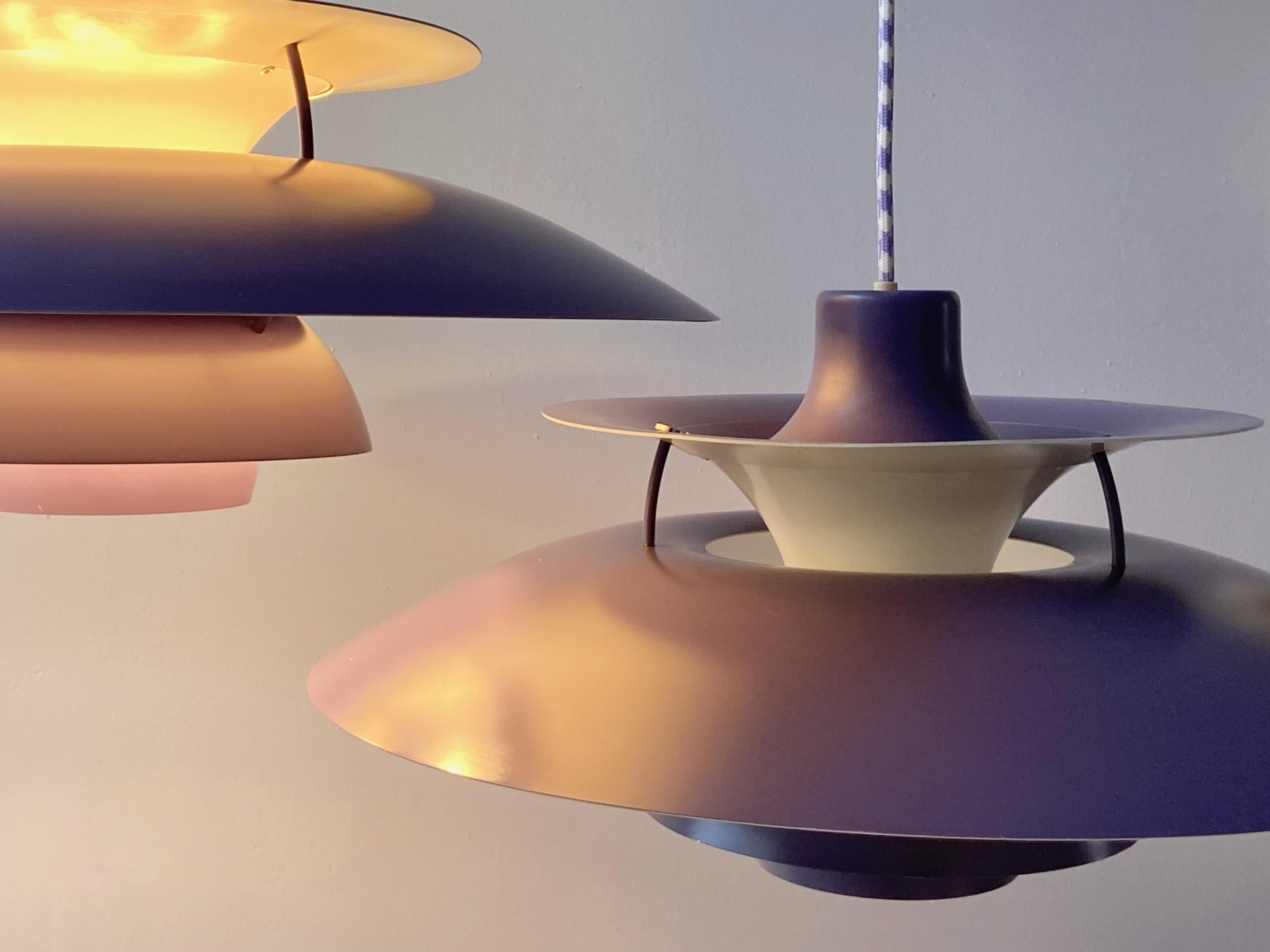 Nice purple PH5 pendant lamp design by Poul Henningsen produced by Louis Poulsen, Made in Denmark. This is the nice old Version with the orange circle plate for the socket. The lamp is in very nice condition. No parts missing, no dents. 
With new