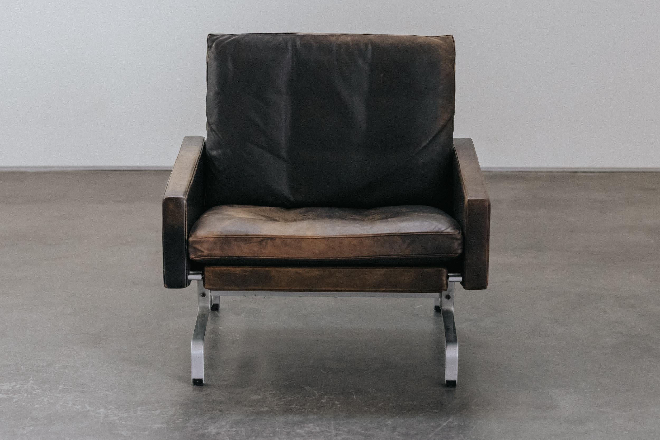 Vintage Poul Kjaerholm PK 31 Lounge Chair From Denmark, Circa 1970.  Nice model, upholstered in original black leather with a fantastic patina. Manufactured by E. Kold Christensen, Denmark.