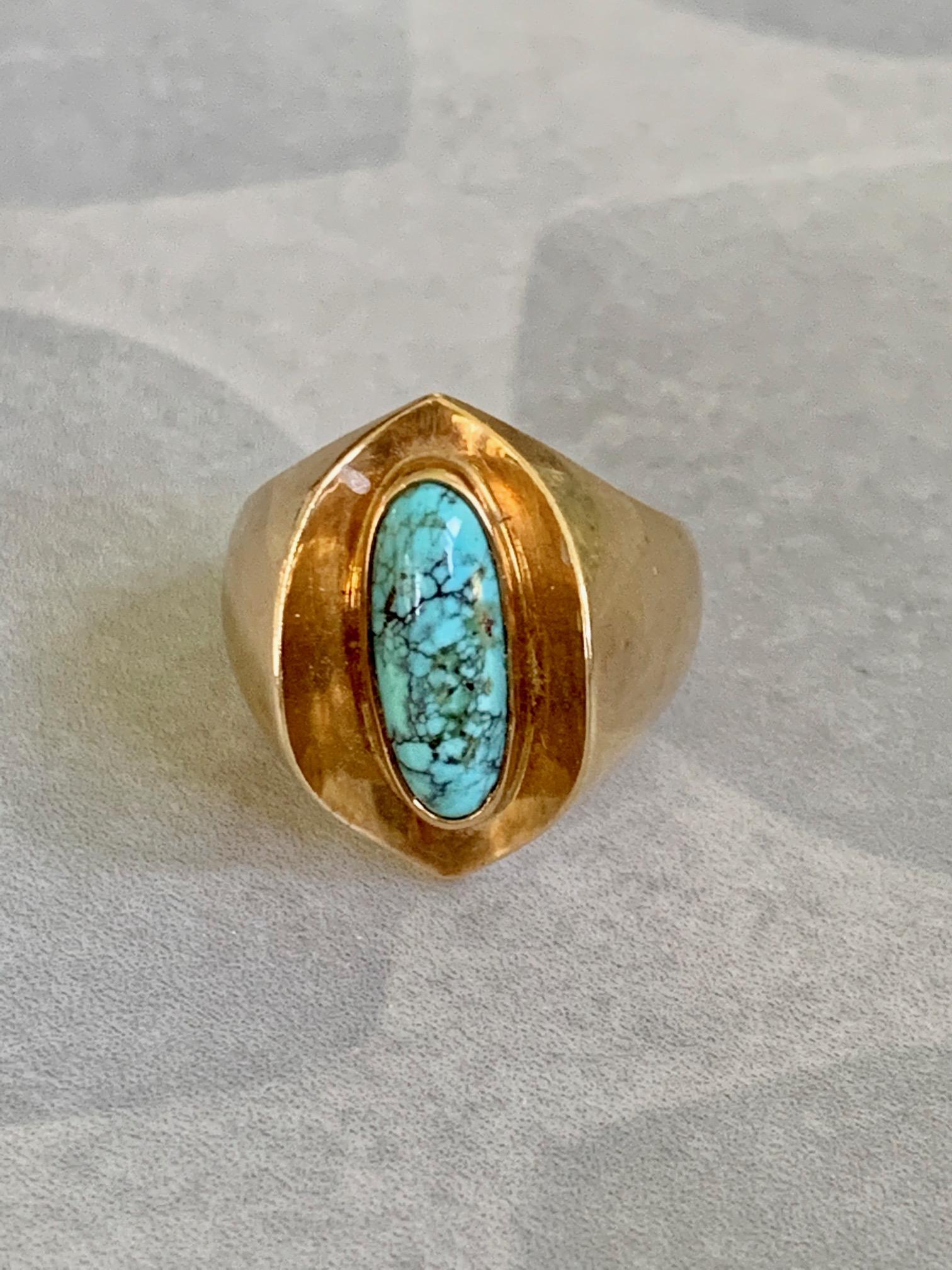 This signed Poul Warmind Denman Turquoise ring is a unique with its pairing of a turquoise stone set in a 18k gold setting.  Absolutely beautiful.

This ring features 1 oval, cabochon, Turquoise = approximately 14 x 7mm.

Size: 6

Weight: 8.4
