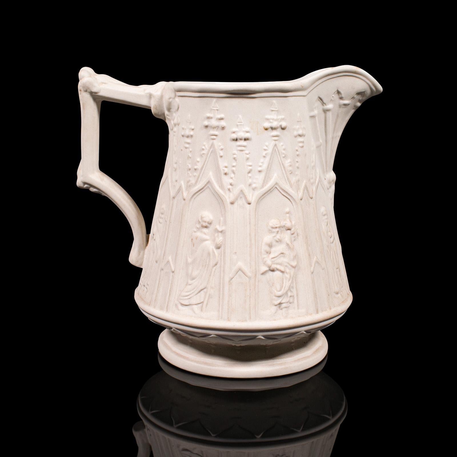 This is a vintage pouring jug. An English, Parian Ware ceramic serving creamer, dating to the late 20th century, circa 1980.

Appealing Parian Ware form, with charming decorative relief
Displays a desirable aged patina and in good original