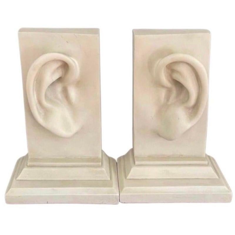Vintage Pop Art Large Pair of Heavy Sculptural Ear Lobe Bookends

Fabulous, Fun, oversized, substantial, postmodern sculptural and functional Ear lobe set of bookends. Engraved C2C 

Weighty, faux marble, possibly resin, off white, set with a