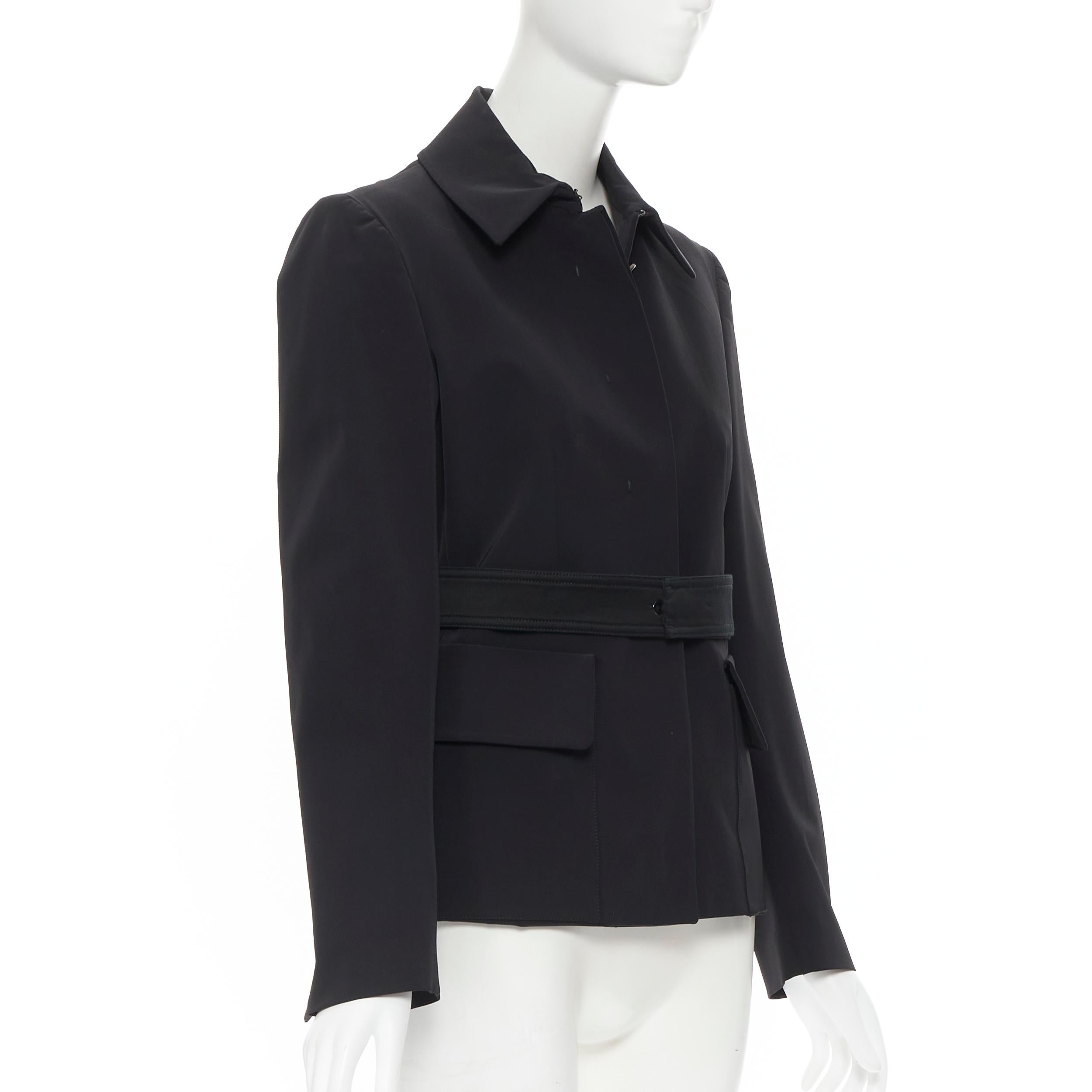 vintage PRADA black classic nylon blend minimalist belted utility jacket IT42 
Reference: GIYG/A00066 
Brand: Prada 
Designer: Miuccia Prada 
Material: Polyester 
Color: Black 
Pattern: Solid 
Closure: Button 
Extra Detail: Concealed button.
