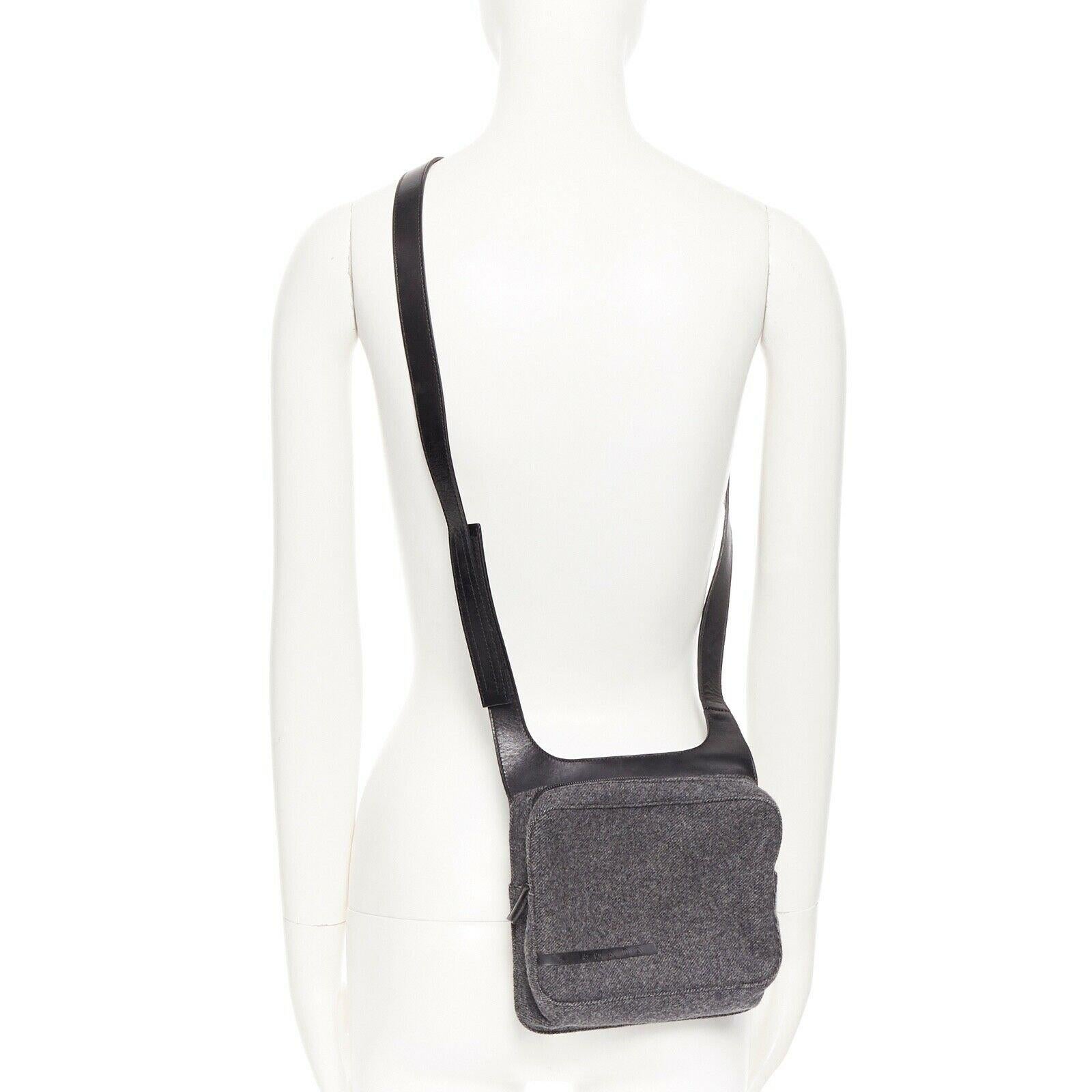 vintage PRADA grey wool leather zipper strap crossbody shoulder square bag 
Reference: TGAS/A03415 
Brand: Prada 
Designer: Miuccia Prada 
Model: Crossbody bag 
Material: Wool 
Color: Grey 
Pattern: Solid 
Closure: Zip 
Extra Detail: Grey wool