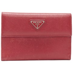 vintage PRADA red saffiano leather triangular plaque flap wallet