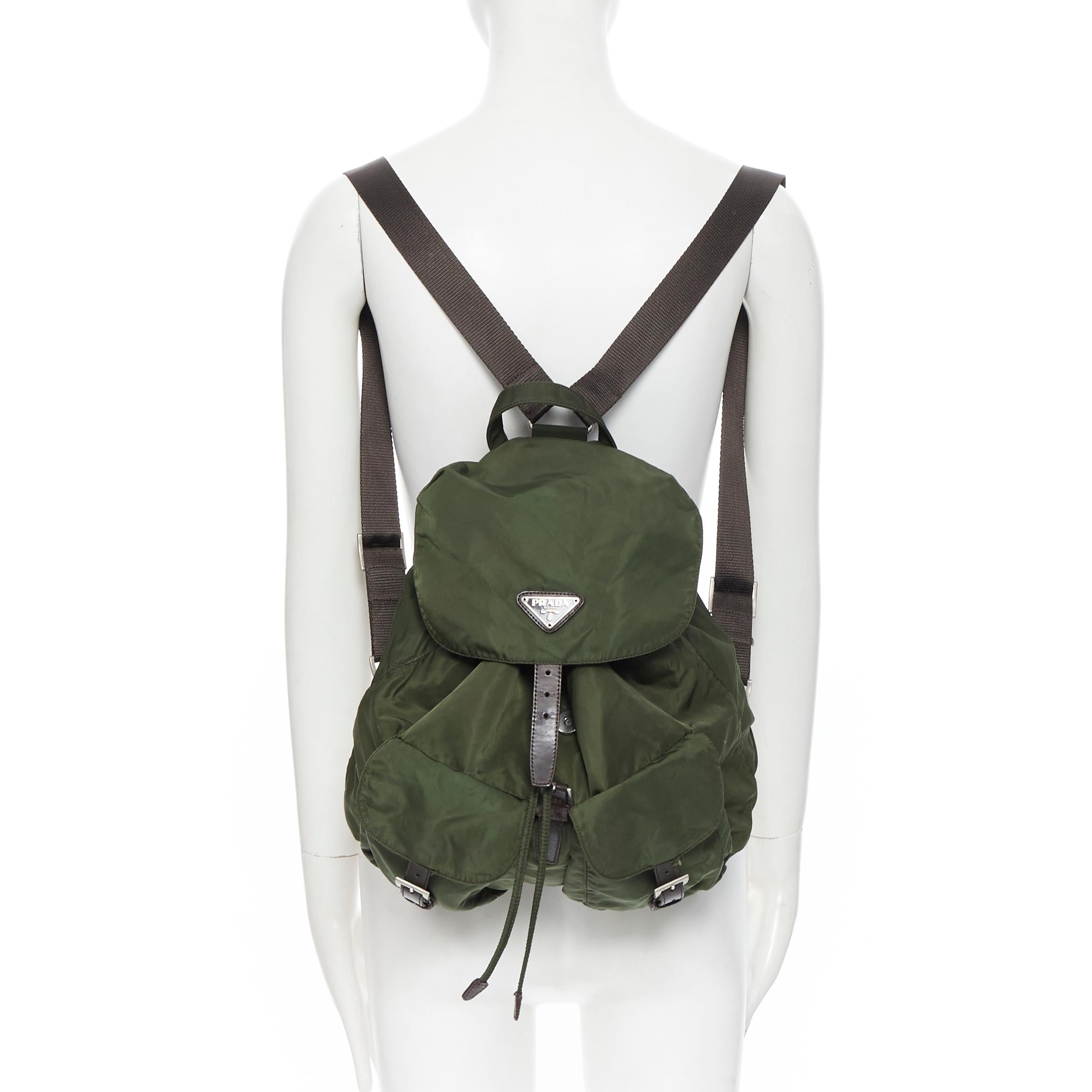 vintage PRADA Tessuto green nylon leather trimmed dual pocket backpack bag
Brand: Prada
Model Name / Style: Nylon backpack
Material: Nylon
Color: Green
Pattern: Solid
Closure: Drawstring
Extra Detail: Drawstring detail. Dual front pocket. Leather
