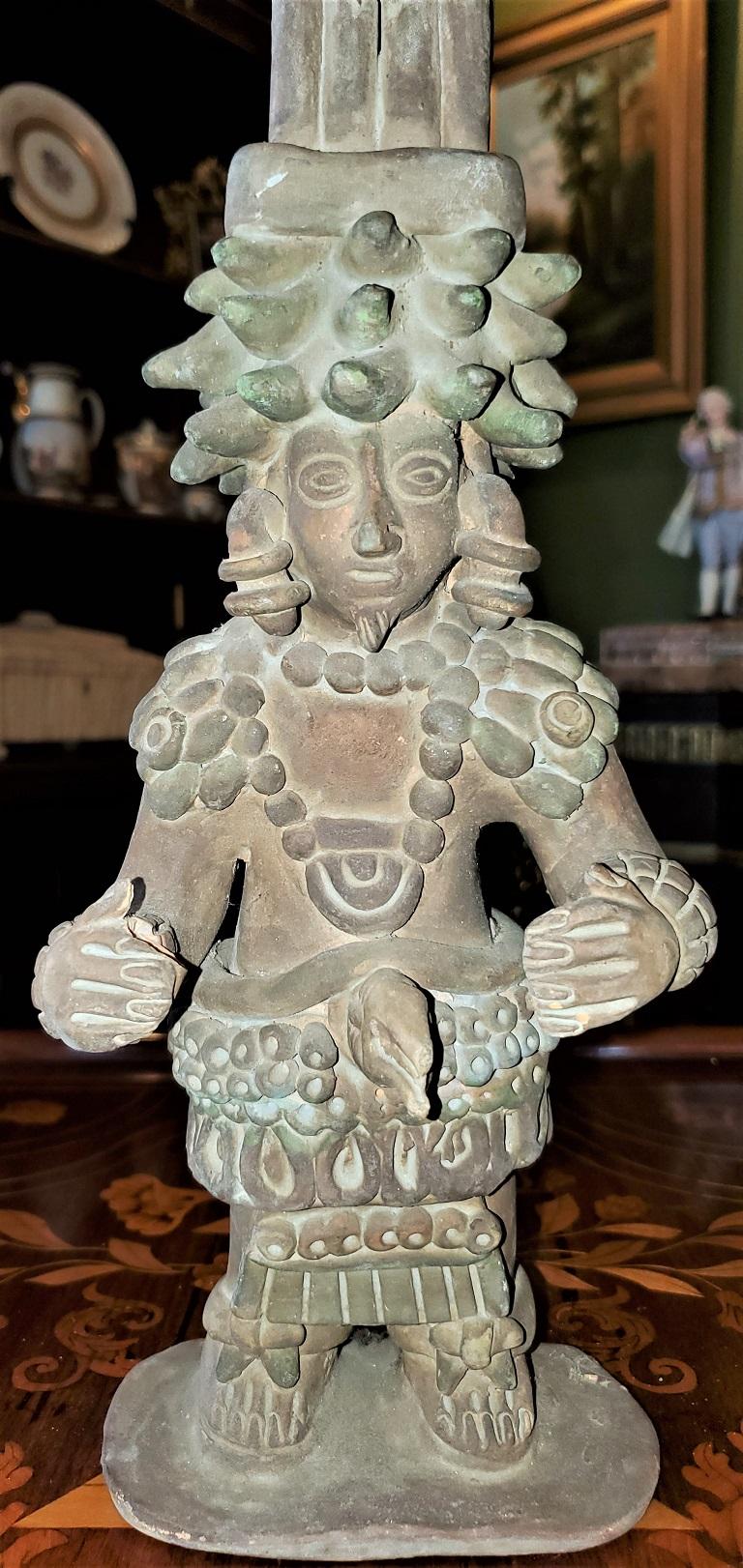 Presenting a lovely piece of reproduction Native American antiquity, namely, a vintage Pre-Columbian style Mayan Warrior.

From circa the early 20th century and probably made in Mexico.

The centerpiece is very Mayan in form and shape with a