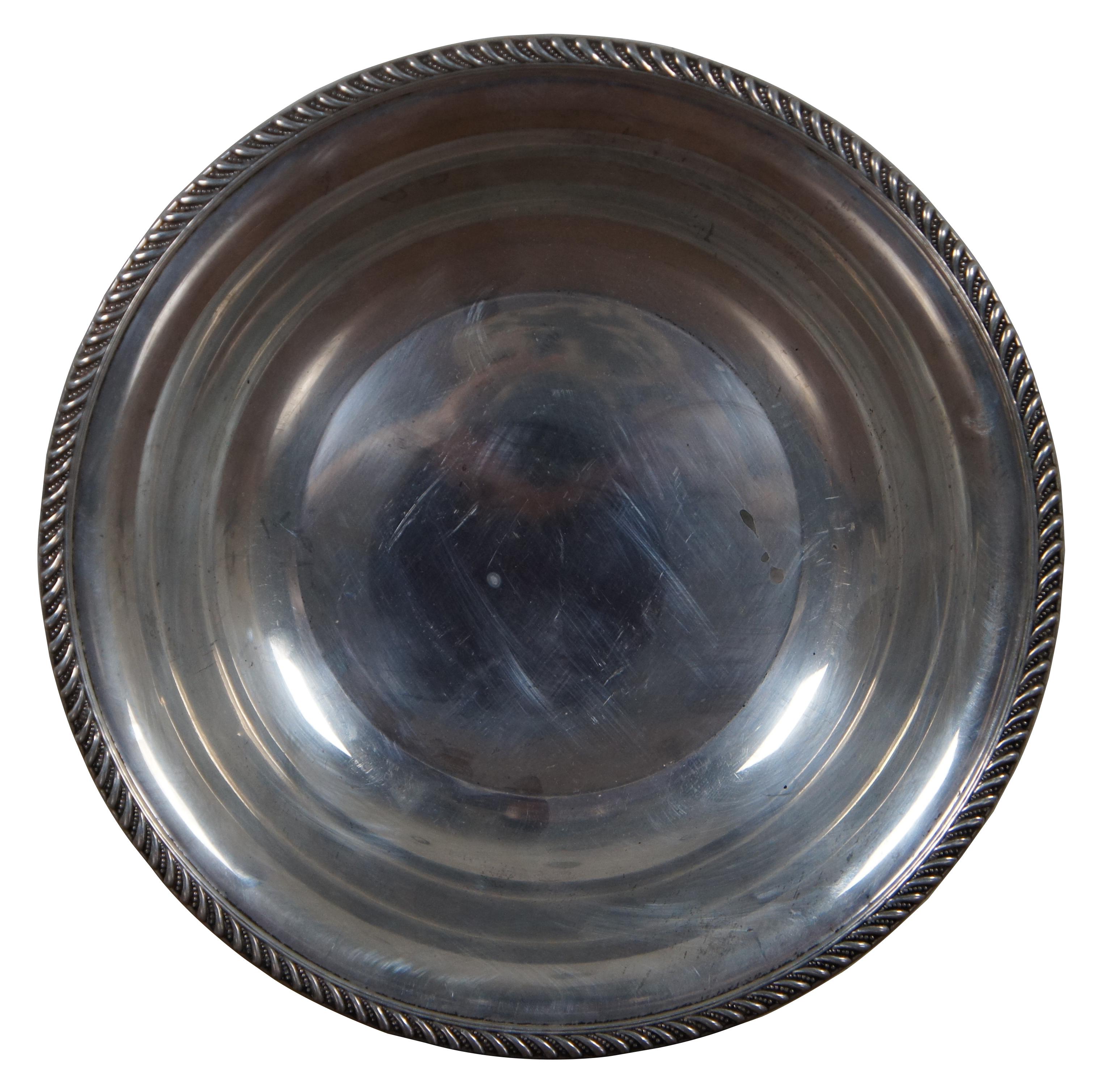 Mid-20th century Preisner sterling silver serving bowl with Gadrooning edge.

“PREISNER SILVER COMPANY - Wallingford, CT - Active since 1935.”