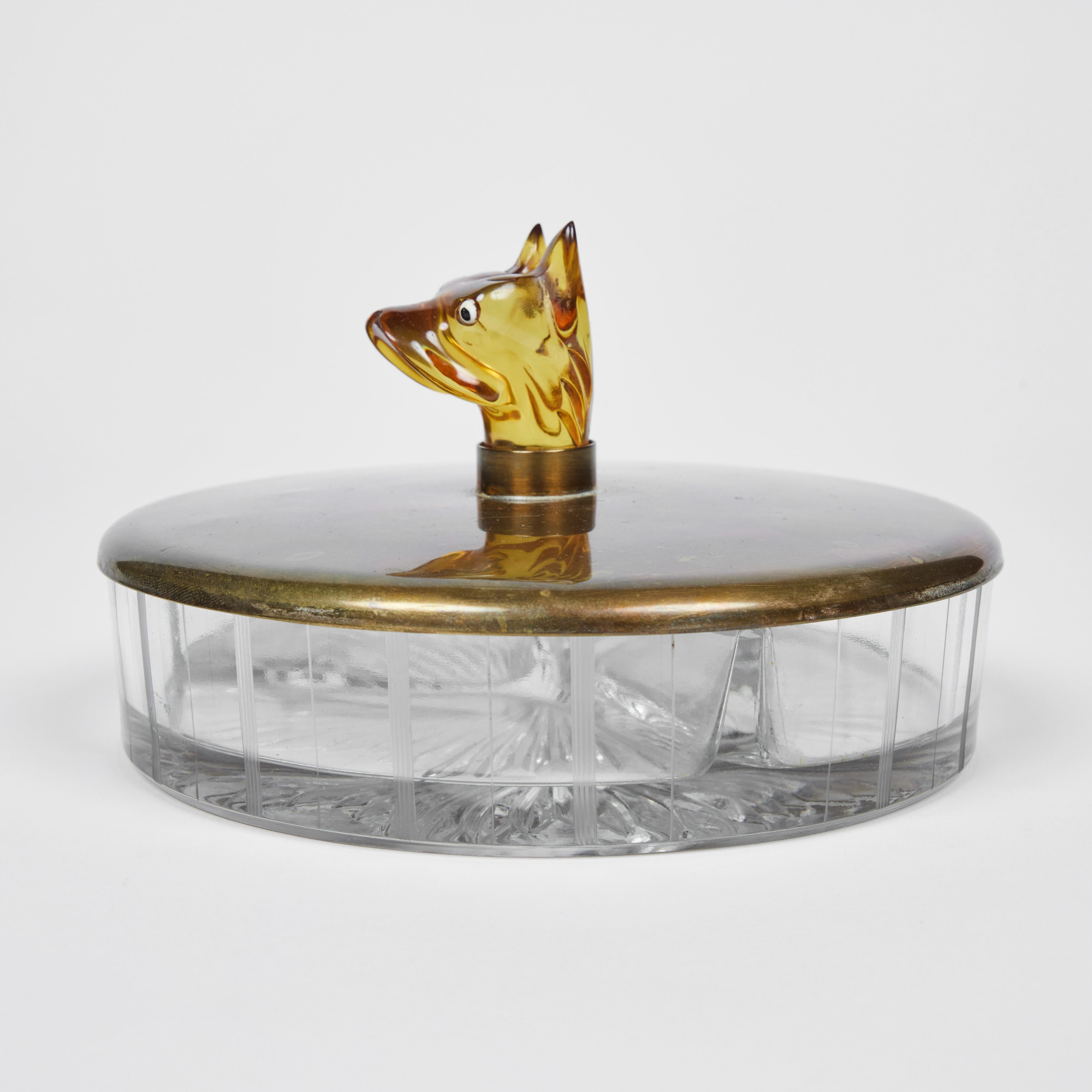 Functional and definitely a conversation piece, this vintage pressed glass dish is so fun. It has 3 sections and a smooth brass lid accented with a clever and beautifully transparent Catalin Boxer dog head handle. What a fun way to display or serve