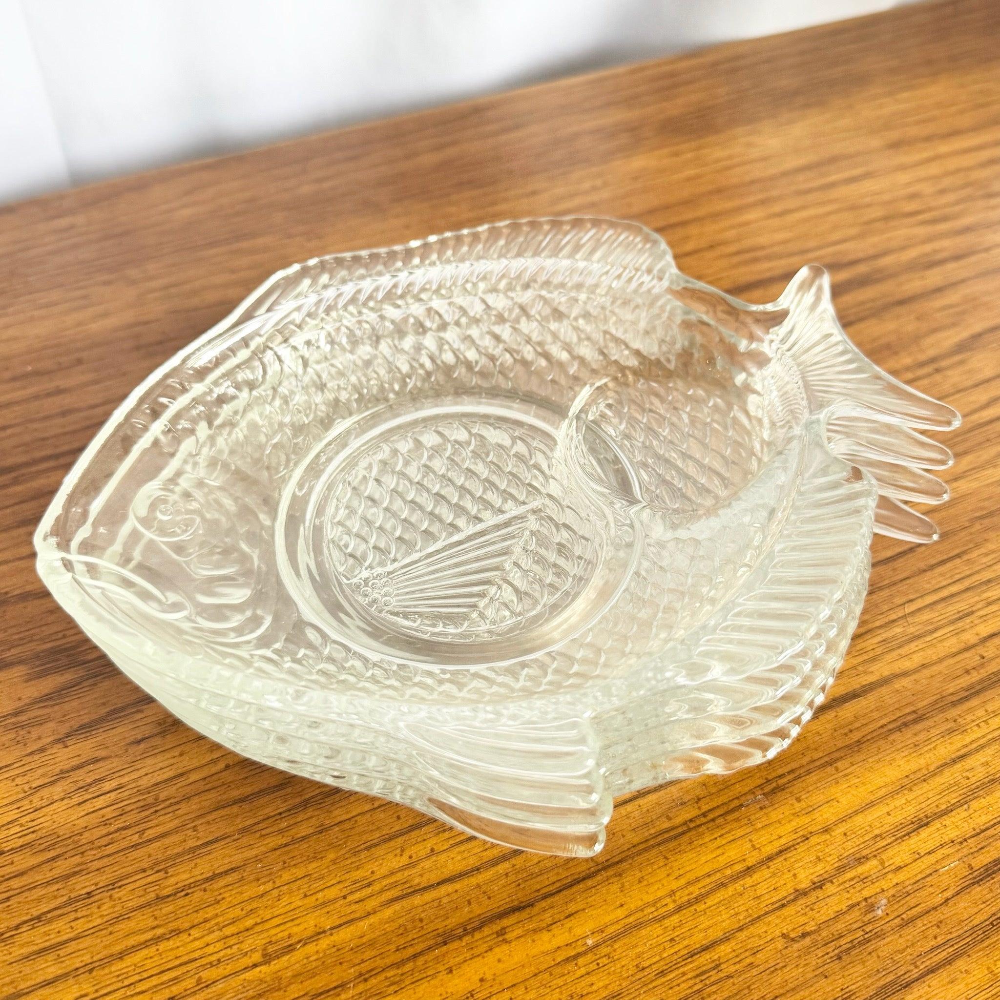 Vintage Pressed Glass Fish Plates set of four—coastal-retro charm with detailed scales and divided centers, ideal for seafood, snacks, and entertaining.
 

 We sell items as acquired, without restoring or repairing. Vintage pieces may have