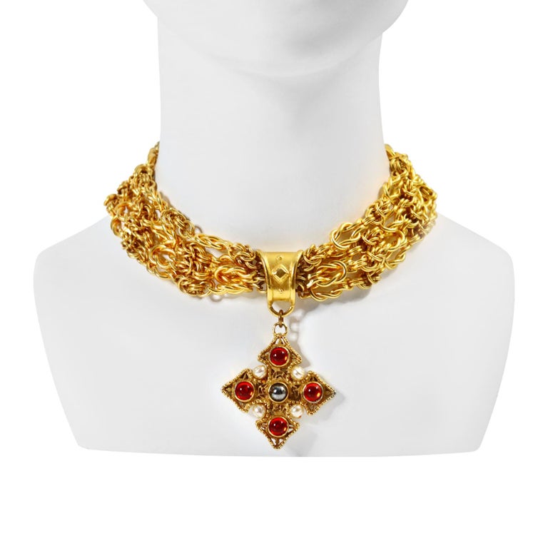 Vintage Prevost Gold Tone 4 strand Choker Necklace with Dangling Maltese Cross. There are 4 heavy Link chains that make this necklace up with a piece that has faux pearls and red and black shiny cabochons.  Quite substantial. 16