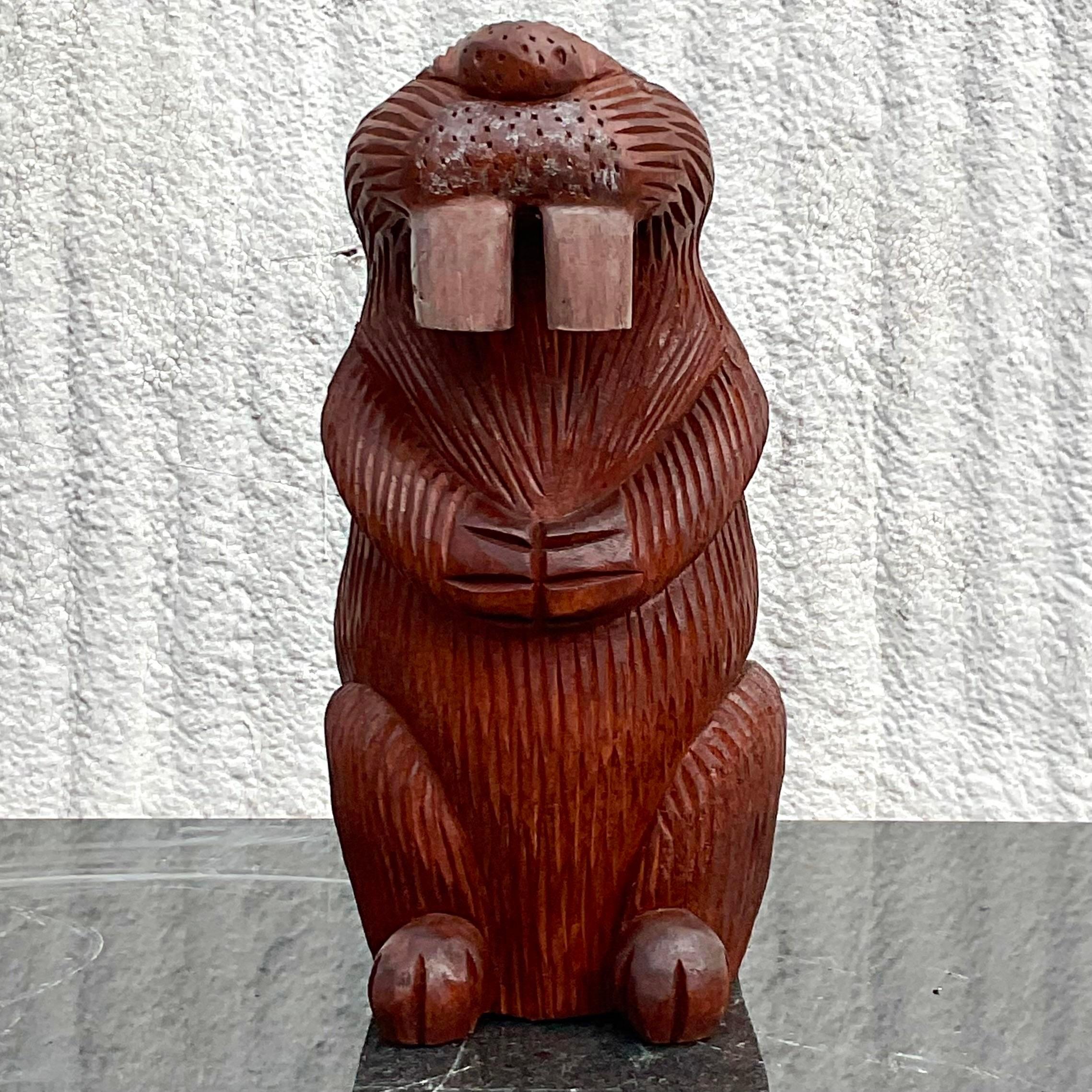 A fantastic vintage Primitive carved wood sculpture. A charming beaver sitting up. A great way to add a little charm to any space. Acquired from a Palm Beach estate.