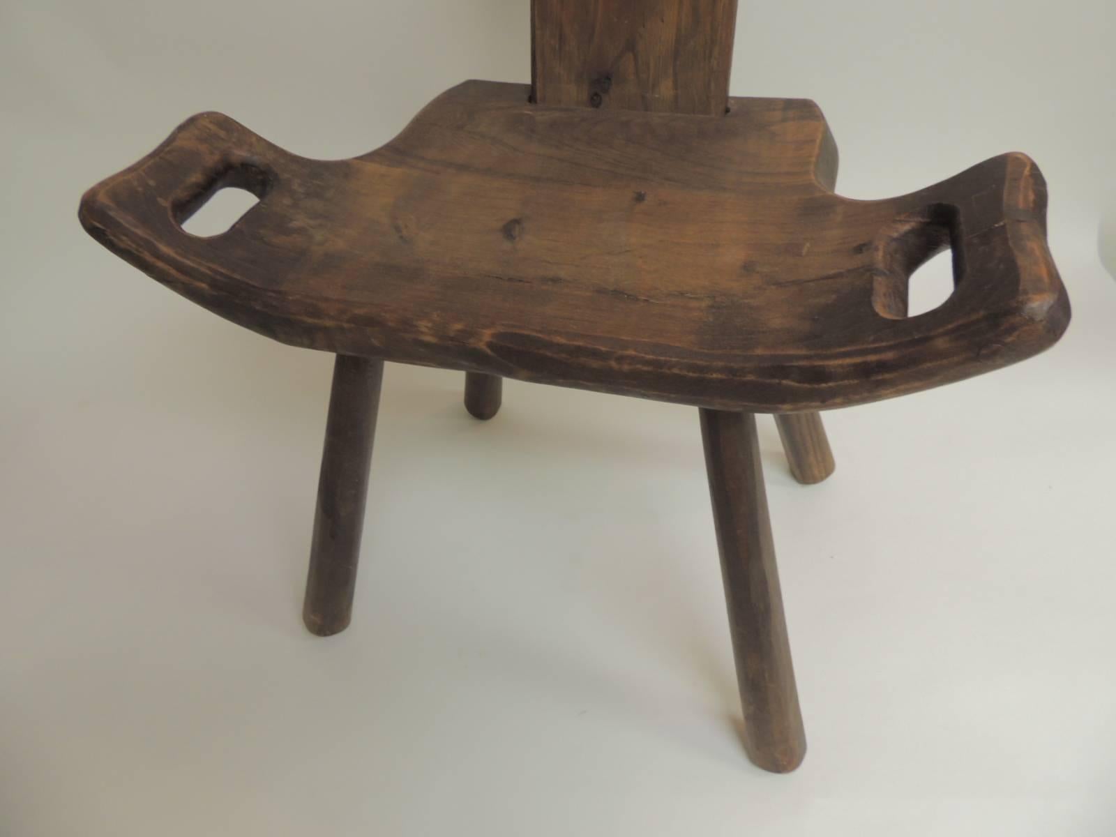 Vintage primitive rustic Belgian artisanal birthing chair with four legs
Vintage birthing chair with four legs and quatrefoil piercing in the back. Artisanal made with carved wood in the seat and the back. Nice patina on the carved wood due to