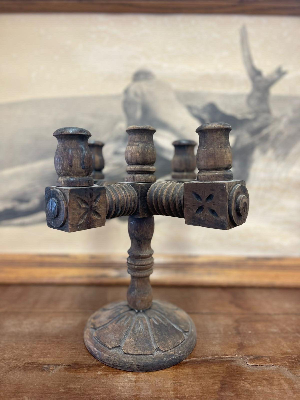 Vintage Candelabra Solid Wood, Intricate Carvings, Cover the Entire Piece. Round Base. Vintage Condition Consistent with Age as Pictured.

Dimensions. 13 1/2 W ; 13 1/2 D ; 15 H