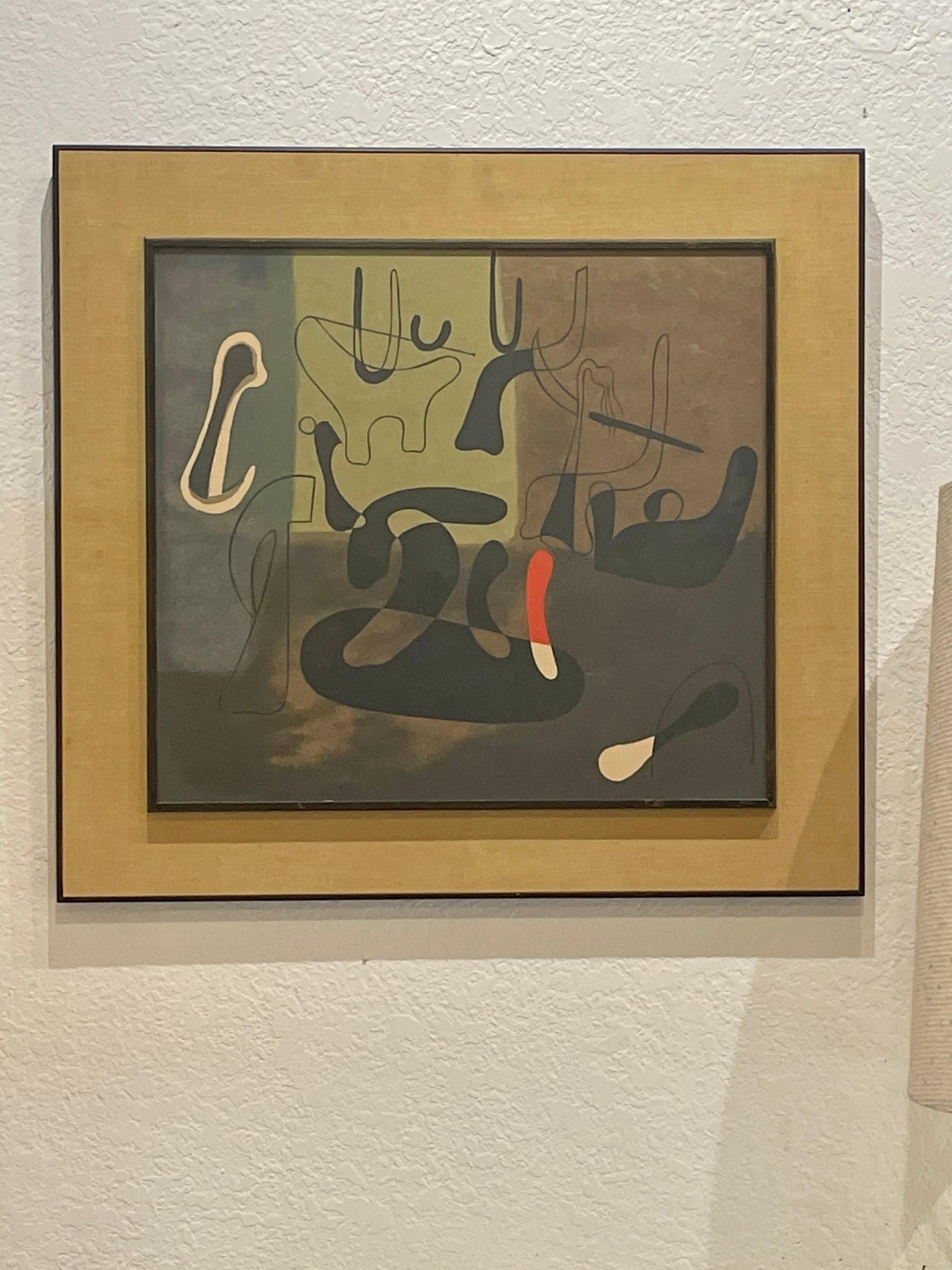 Beautiful vintage print by Joan Miro, nicely framed in black wood edge and grasscloth mat with glass.