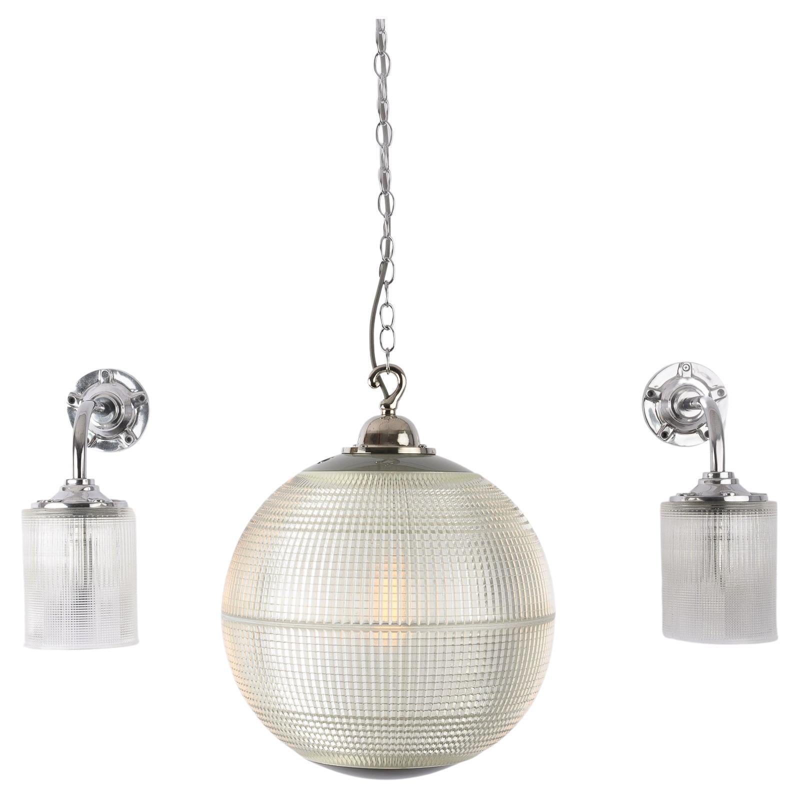 Price is per light.

A stunning run of reclaimed vintage prismatic glass globes made in France circa 1960 by Holophane.

Previously used to illuminate the streets of Paris at its surrounding districts.

The globes have been adapted into a