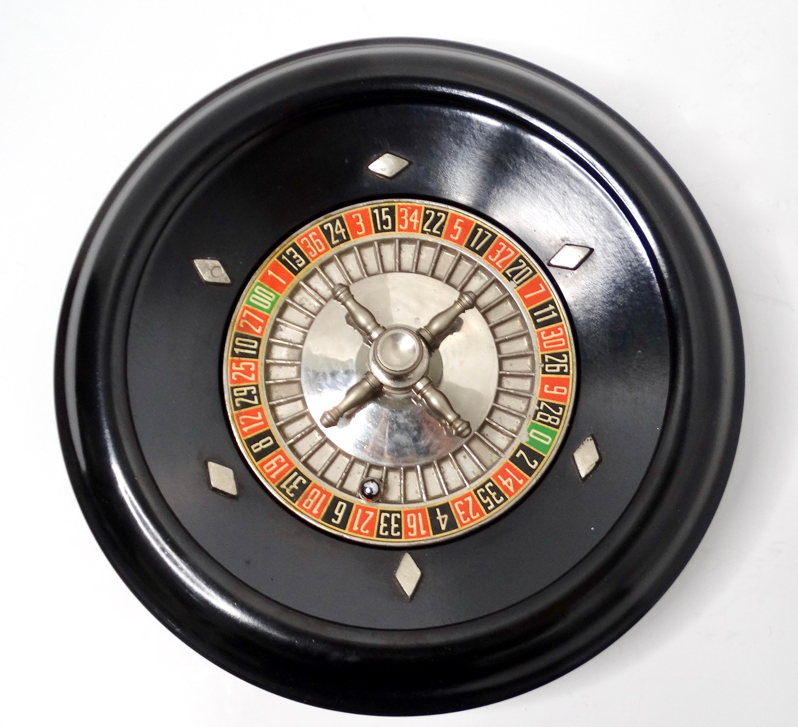 Experience the thrill of classic gaming with this Vintage Professional Grade Wood Roulette & Poker Card Chip Tray Set. The centerpiece of the set is a stunning 16