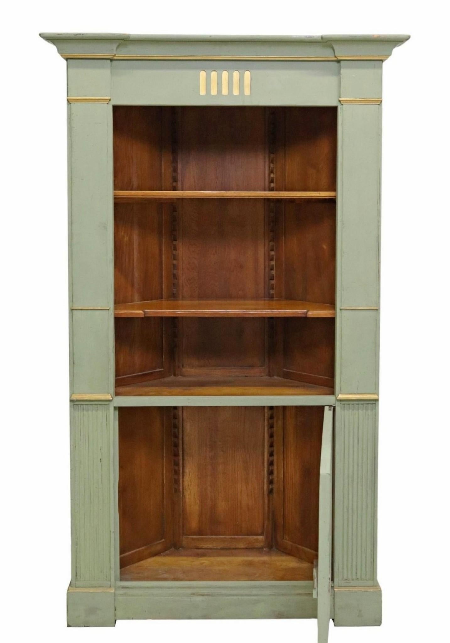 A wonderful vintage Provincial parcel gilt and soft light pale green painted wood corner cabinet by de Bournay. 

Born in France in the mid-20th century, exquisitely hand-crafted in Swedish Gustavian Louis XVI taste, featuring high-quality