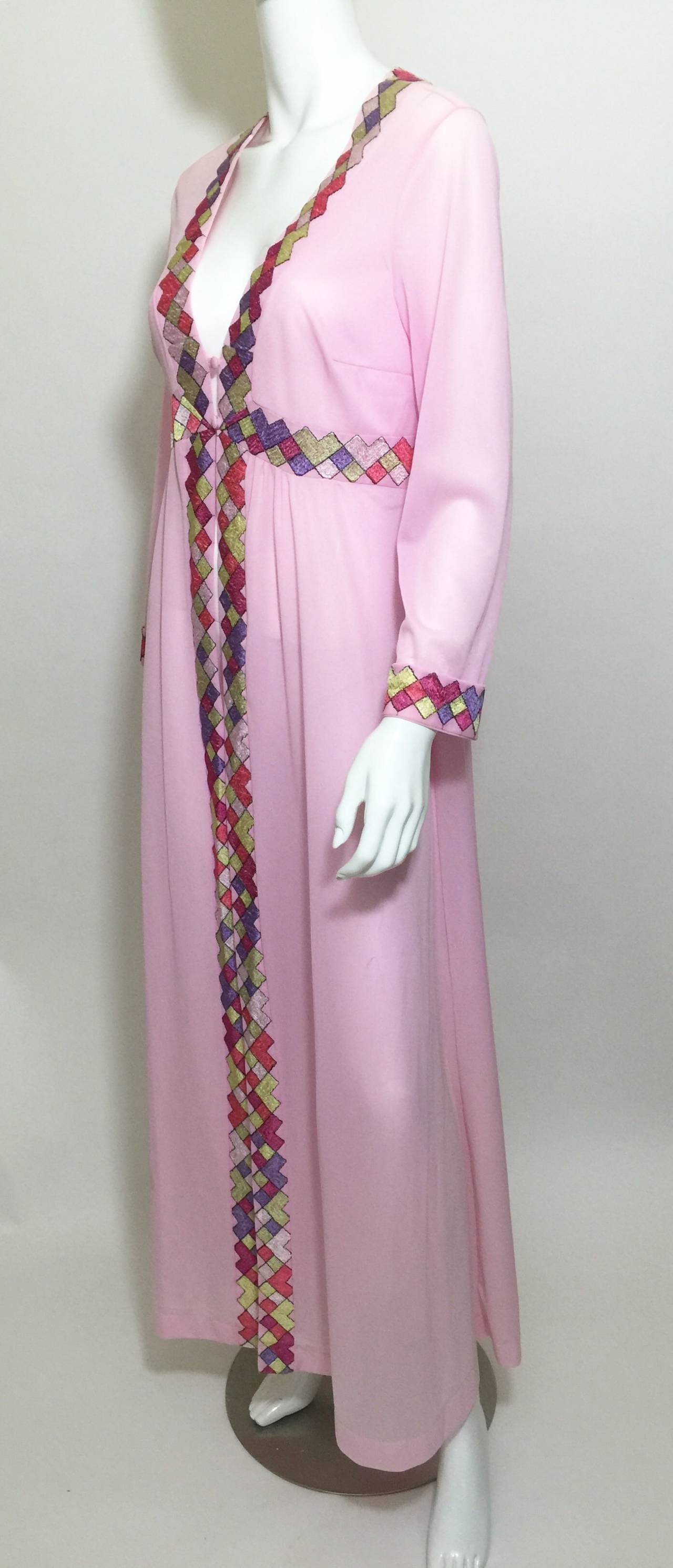 This is quite an unusual piece for a Pucci as the entire body is a solid, with only print and color in the trimmings. Beautiful and ethereal with a twist! You can still get your Pucci fix with the border that surrounds the neckline going all the way