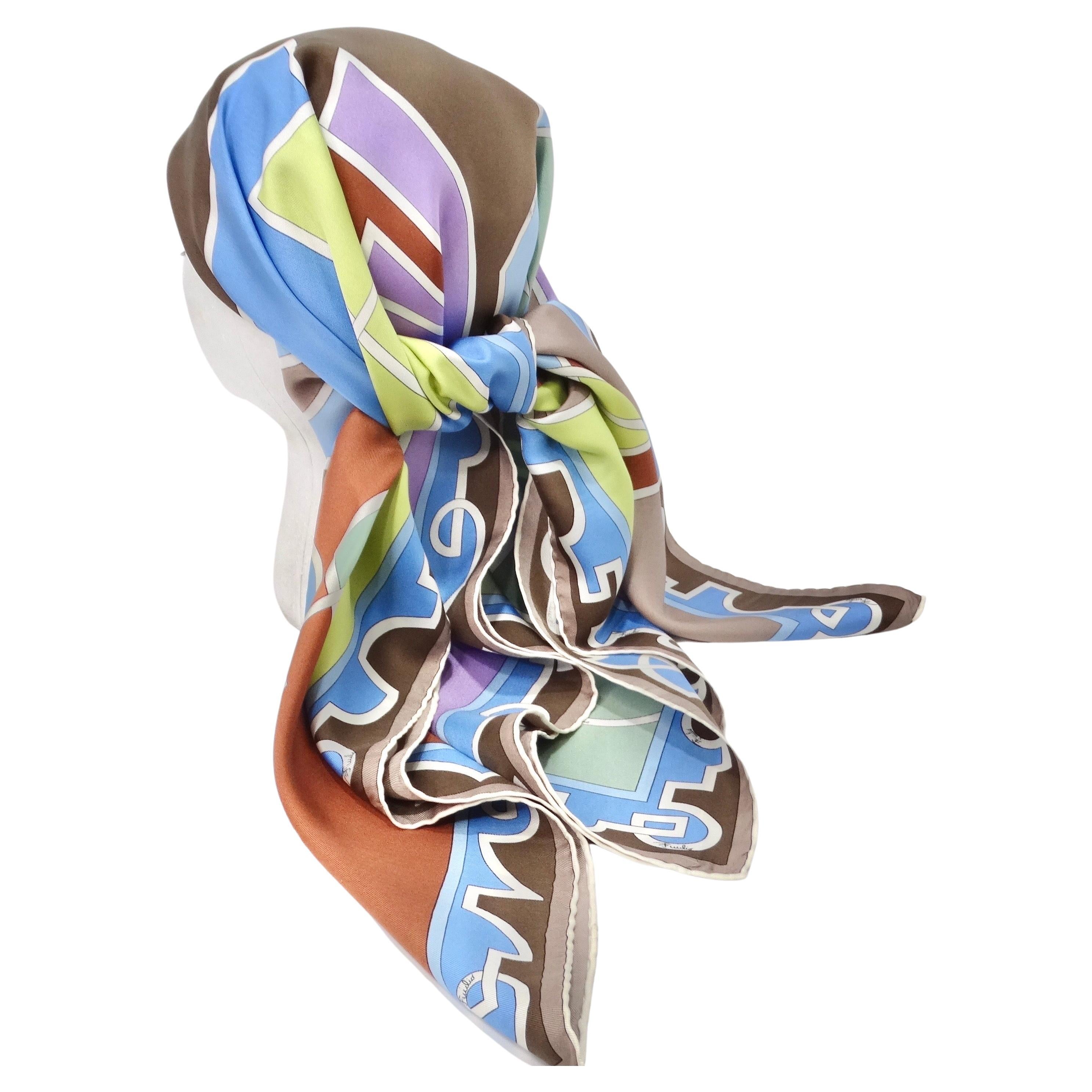 Discover the enchanting world of the Pucci with this incredible silk printed scarf.! This vintage piece showcases a harmonious blend of brown, green, blue, yellow, and purple hues, adorned with elegant white accents and Pucci logos sprinkled