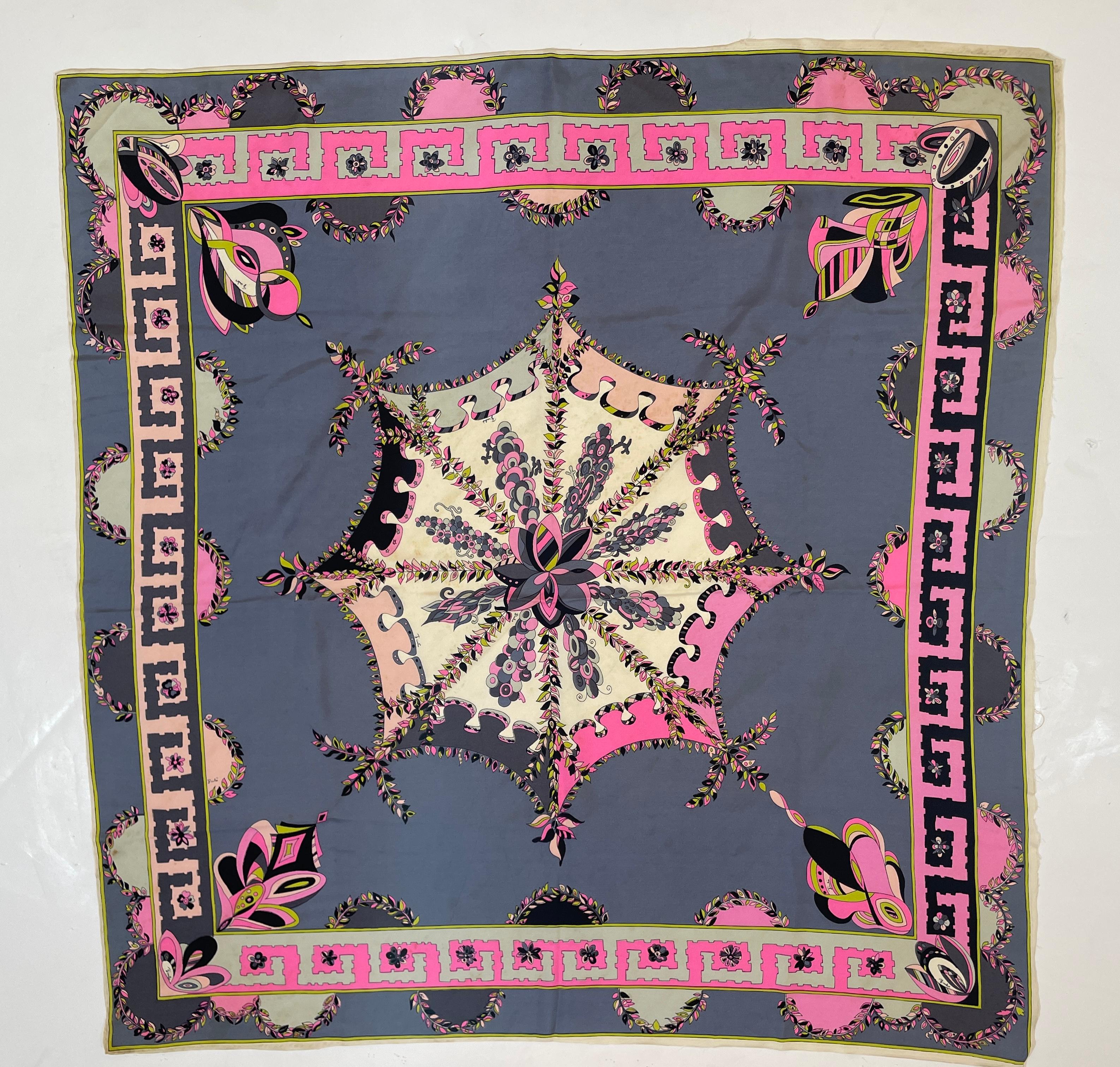 1970's Pucci Silk chiffon scarf in geometric blues and pinks.
This stunning vintage Italian Emilio Pucci silk scarf is a beautiful and colorful abstract design. This Italian vintage Pucci square silk scarf is of luscious colors of hues of blues,