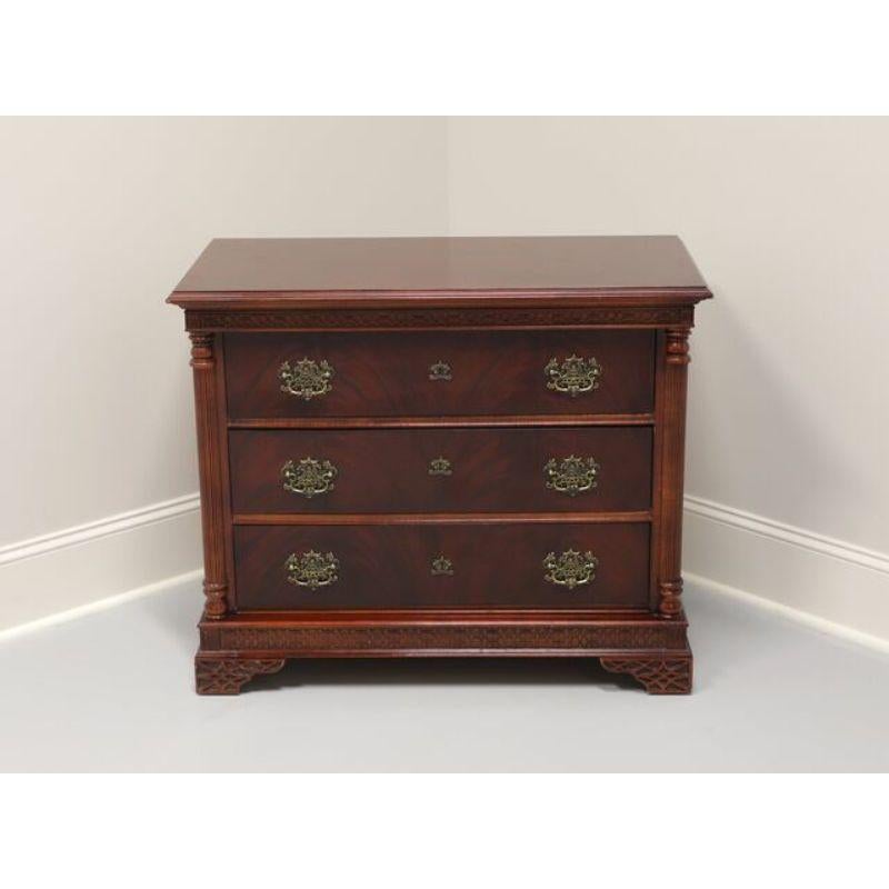 A bachelor chest in the Chinese Chippendale style made by Pulaski Furniture of Pulaski, Virginia, USA. Made in the late 20th Century of solid mahogany construction with Asian influenced brass hardware. Three dovetail drawers, fluted column corners