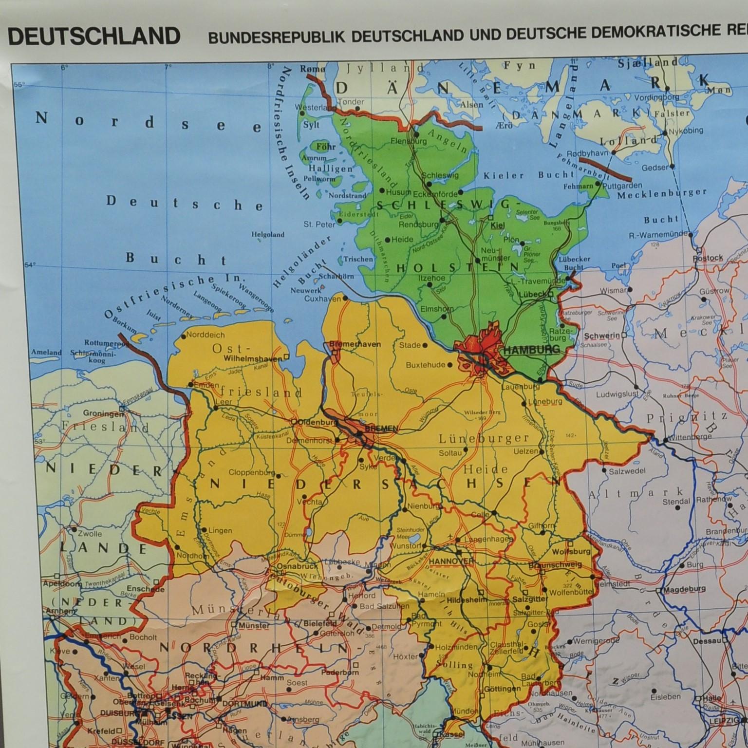 A classical rollable vintage wall chart illustrating a map of Germany (Federal Republic of Germany and German Democratic Republic). published by the Wenschow Reliefkarte. colorful print on paper reinforced with canvas. 
Measurements:
Width 97cm