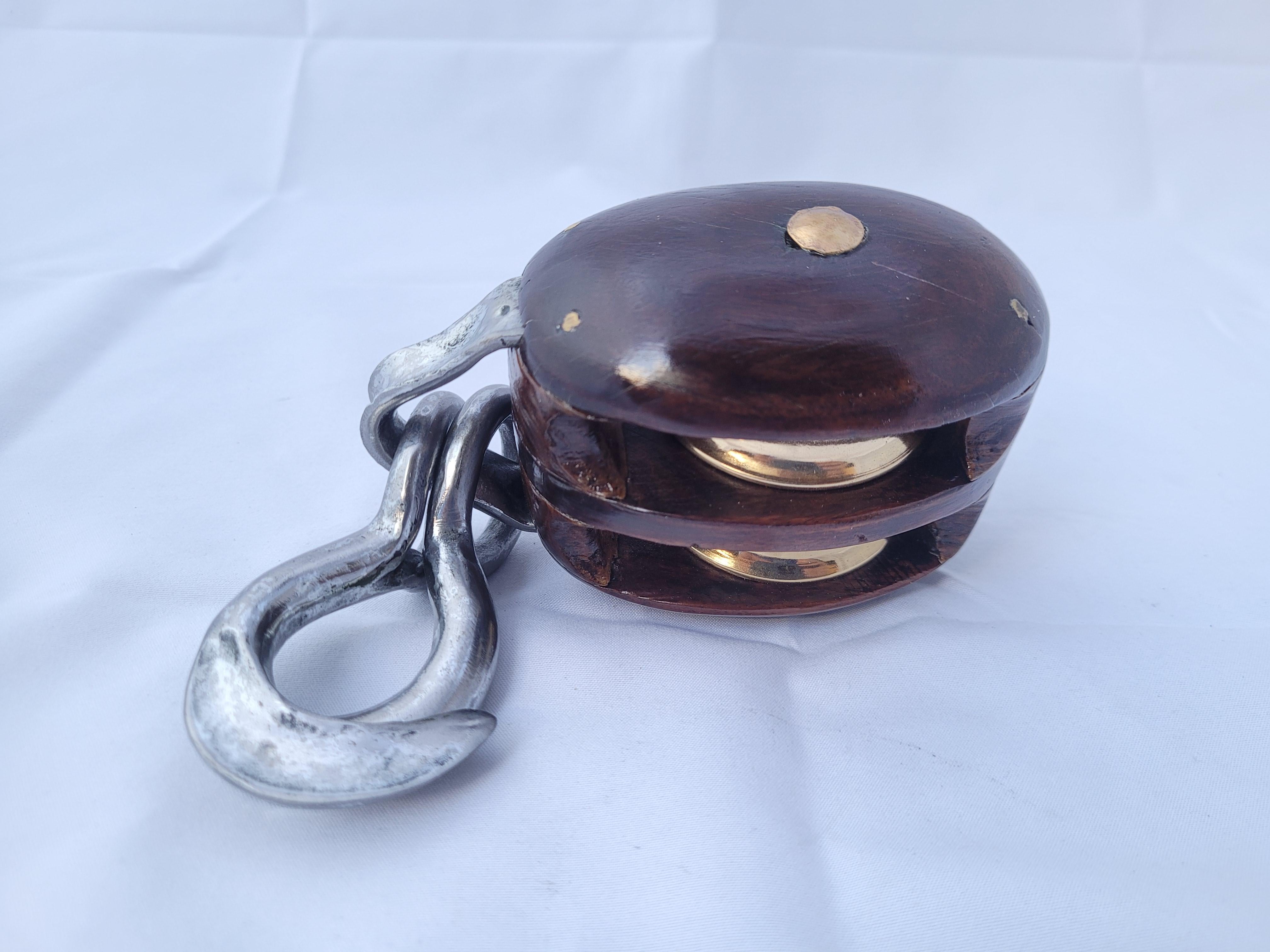 Double sheave yacht pulley with ash case and tobin bronze pins, two polished and lacquered pins and steel 