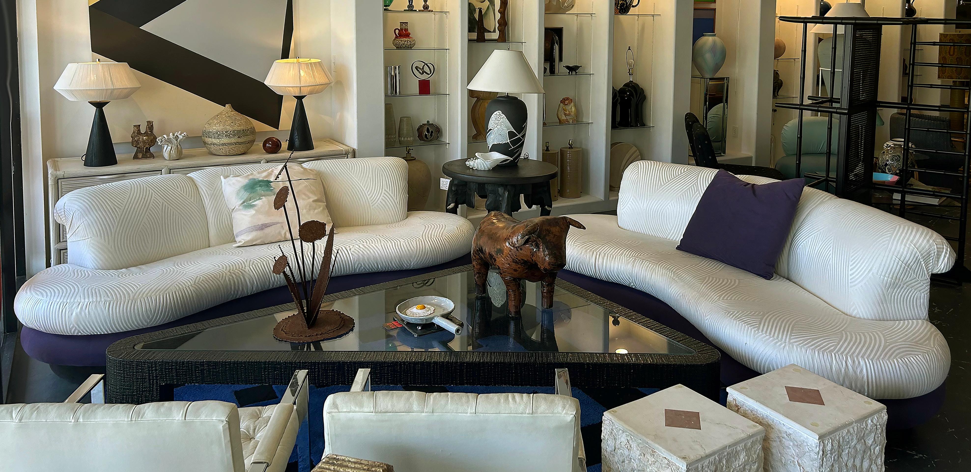Vintage Purple and Off-White Cloud Sofas after Pearsall, Per Item

Offered for sale individually are two Cloud sofas or loveseats by Creative Interiors.  The design is after a sofa by Adrian Pearsall with central backrests that seat three on a