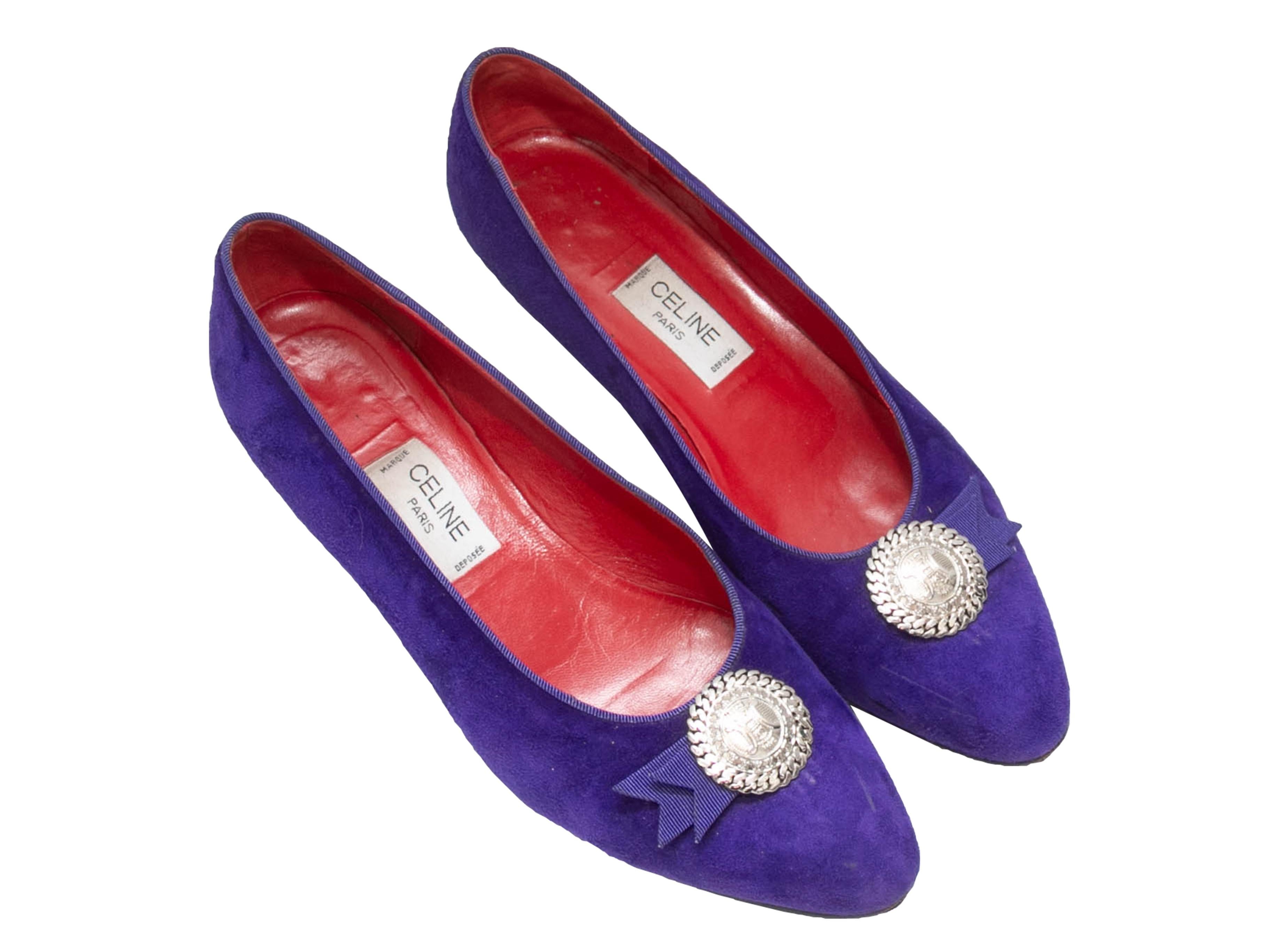 Vintage purple suede ballet flats by Celine. Grosgrain trim. Silver-tone medallion accents at tops. 1.5