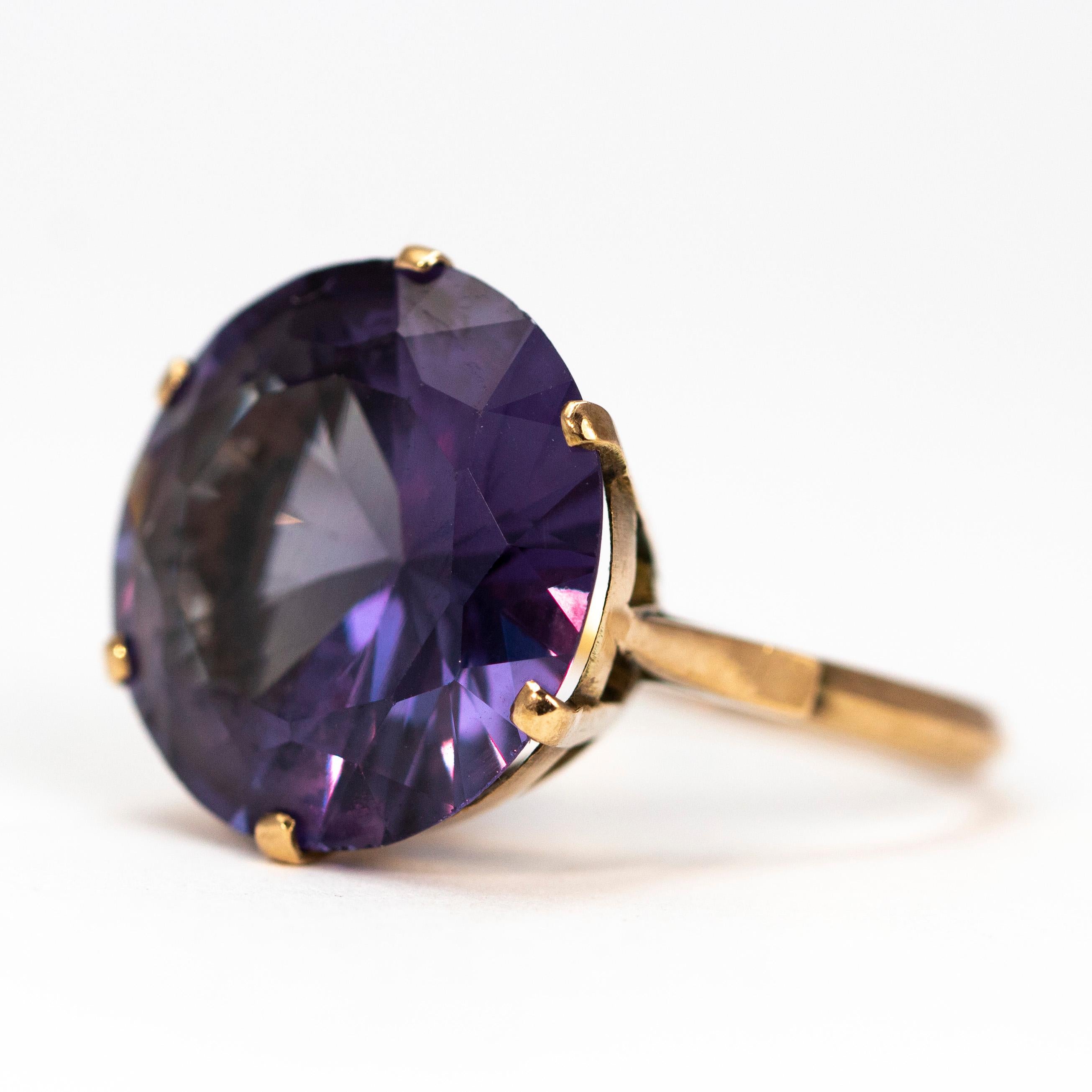 This a gorgeous round stone, and large which is sure to be a show stopper! The stone is purple but also has navy blue and all different tones running through it. The setting is kept very simple and s modelled in 9ct gold. 

Ring Size: O 1/2 or 7