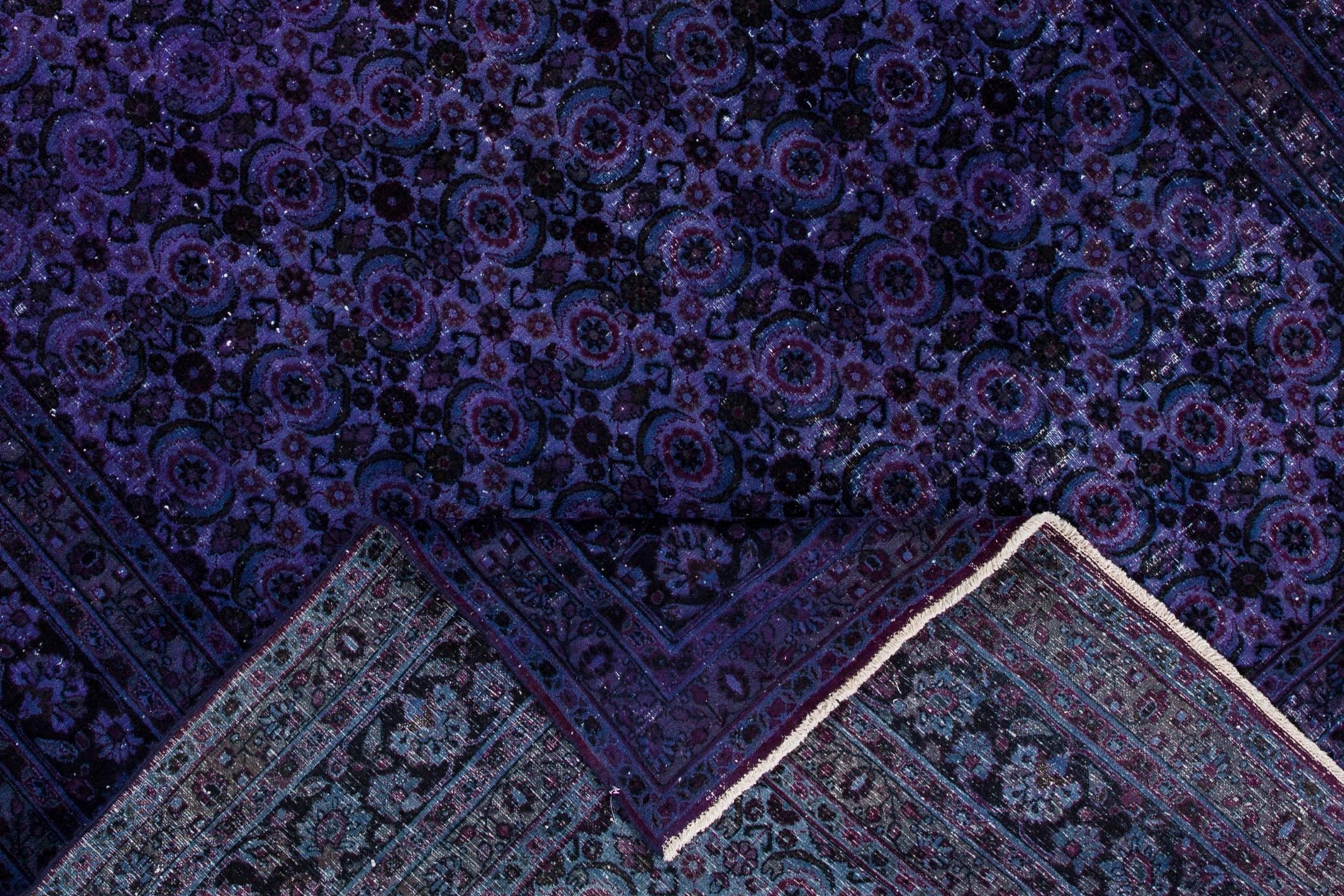 Vintage Persian Tabriz carpet. This piece features a unique, dark purple field with an all-over geometric design. Measures 7.10 x 10.07.