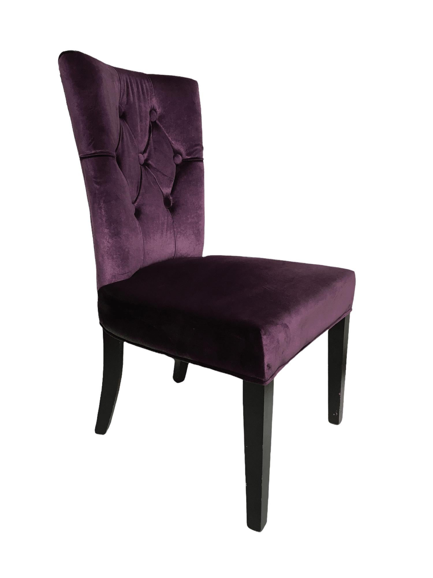 Vintage Purple Velvet Chairs with Tufted Padded Backrest. Set of 2. $1775
 
This set of purple chairs is in great condition. They feature a gorgeous tufted padded backrest, as well as a grommeted edge on its back in gold color. Bent back legs