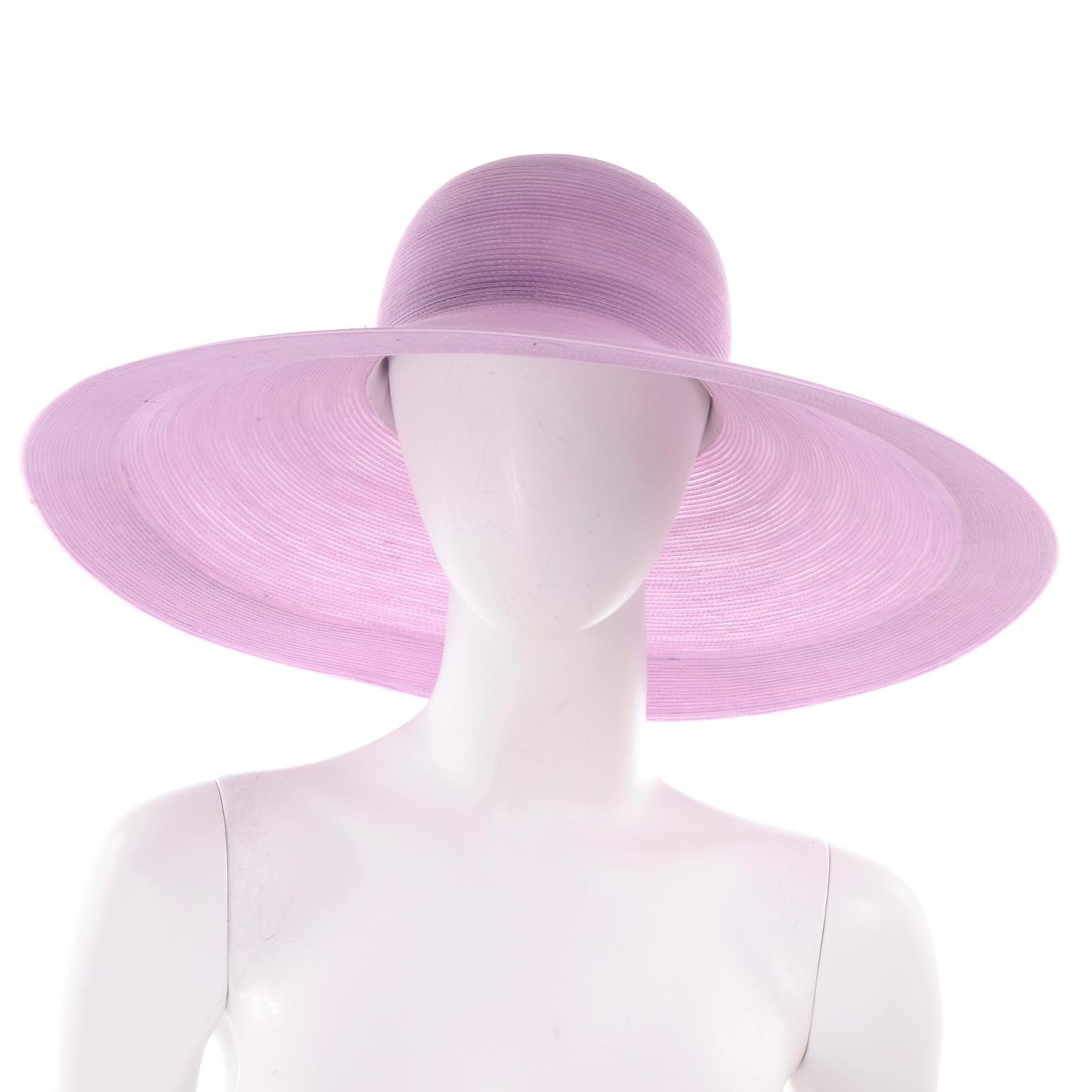 We love vintage Patricia Underwood hats! This one is a woven lavender sun hat with a wide brim, bearing the Patricia Underwood New York black label. This hat has a nice wide brim and you could tie a scarf or ribbon around it if you'd like to change