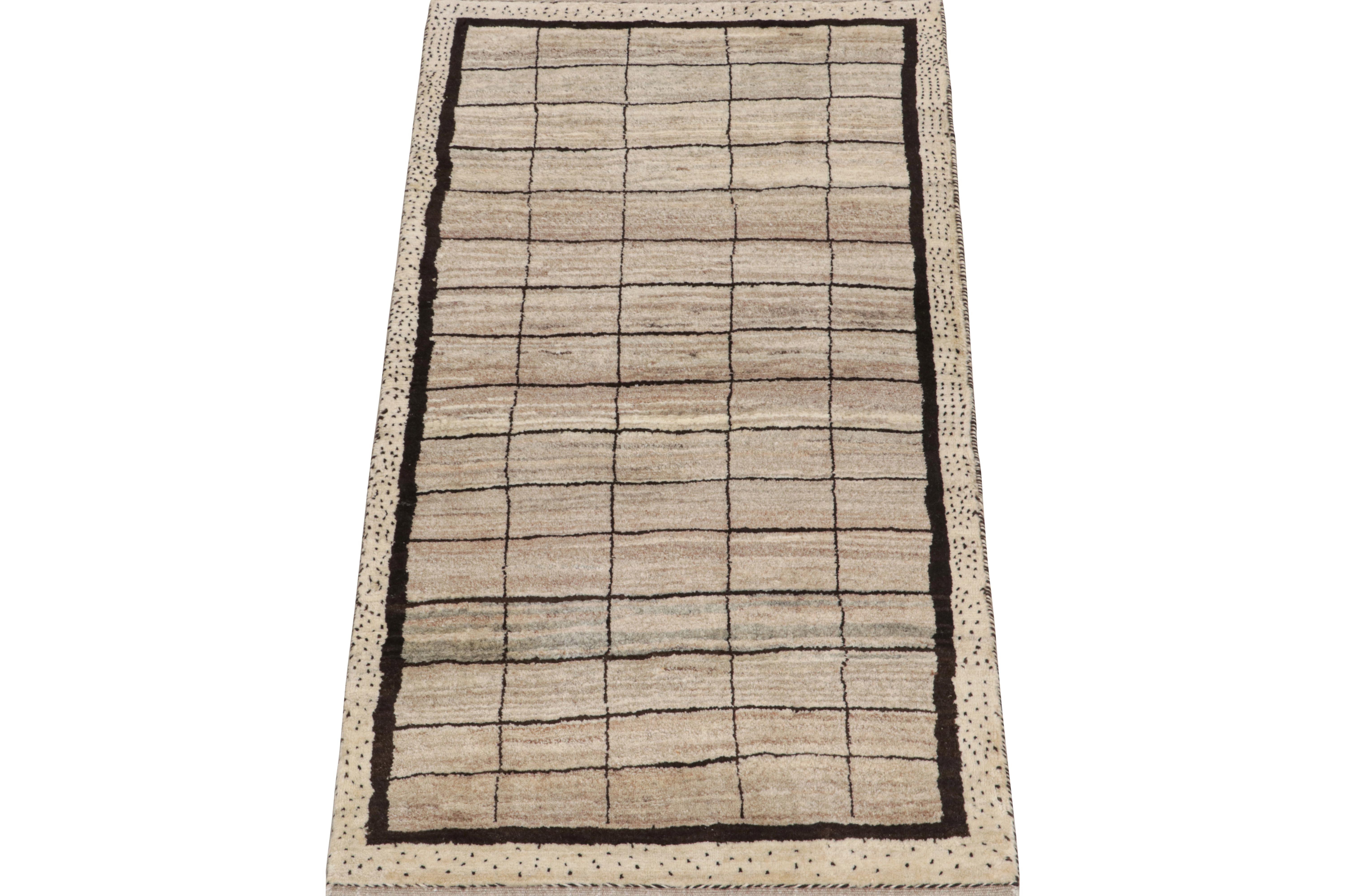 This vintage 2x6 Persian runner is a Gabbeh rug that originates from the Qashqai tribe—hand-knotted in wool circa 1950-1960.

Its geometric pattern enjoys a play of beige and brown in a grid with playful accents therein. Keen eyes will admire the