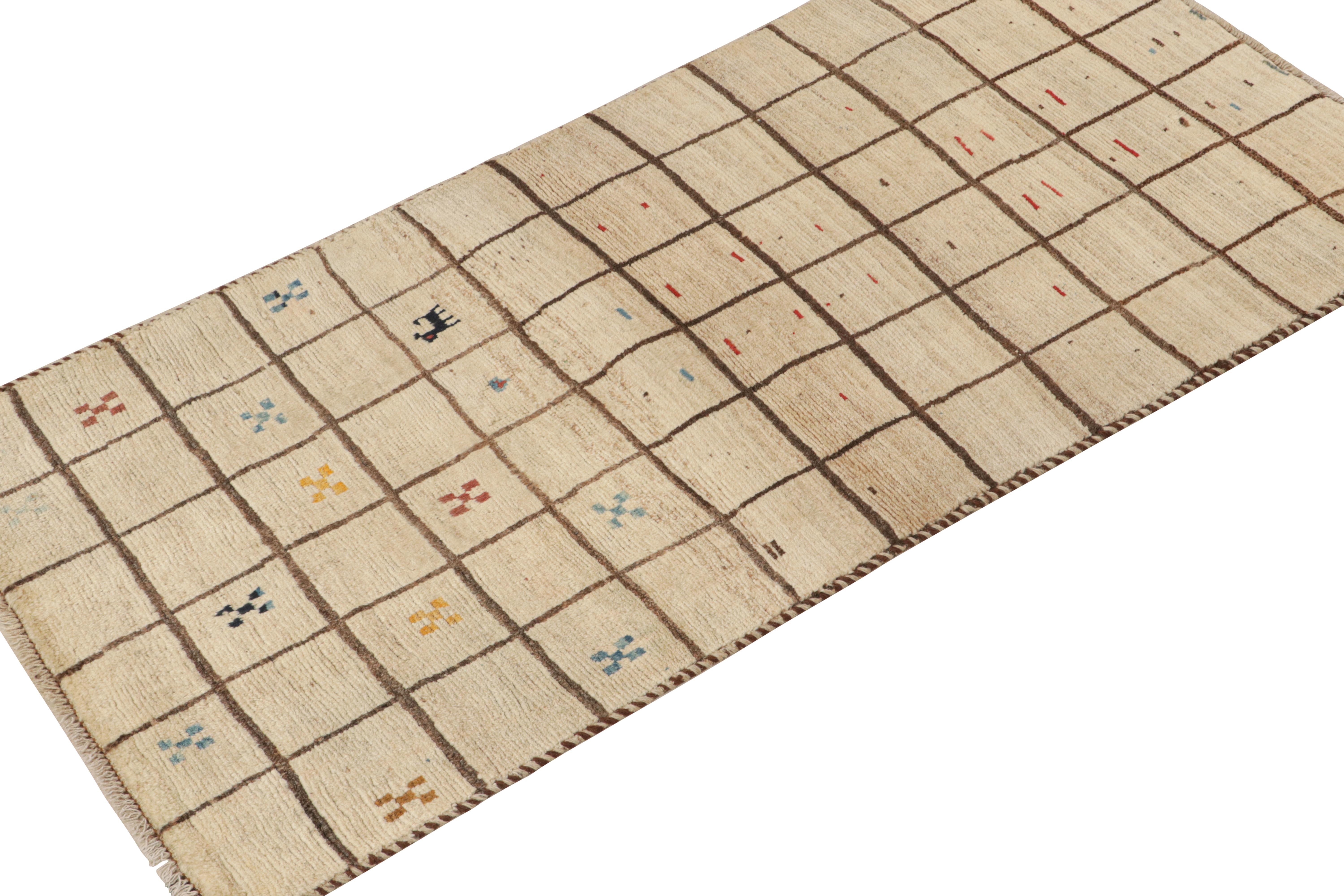 This vintage 2x6 Persian runner is a Gabbeh rug that originates from the Qashqai tribe—hand-knotted in wool circa 1950-1960.

Its geometric pattern enjoys a play of beige and brown in a grid with playful accents therein. Connoisseurs will further