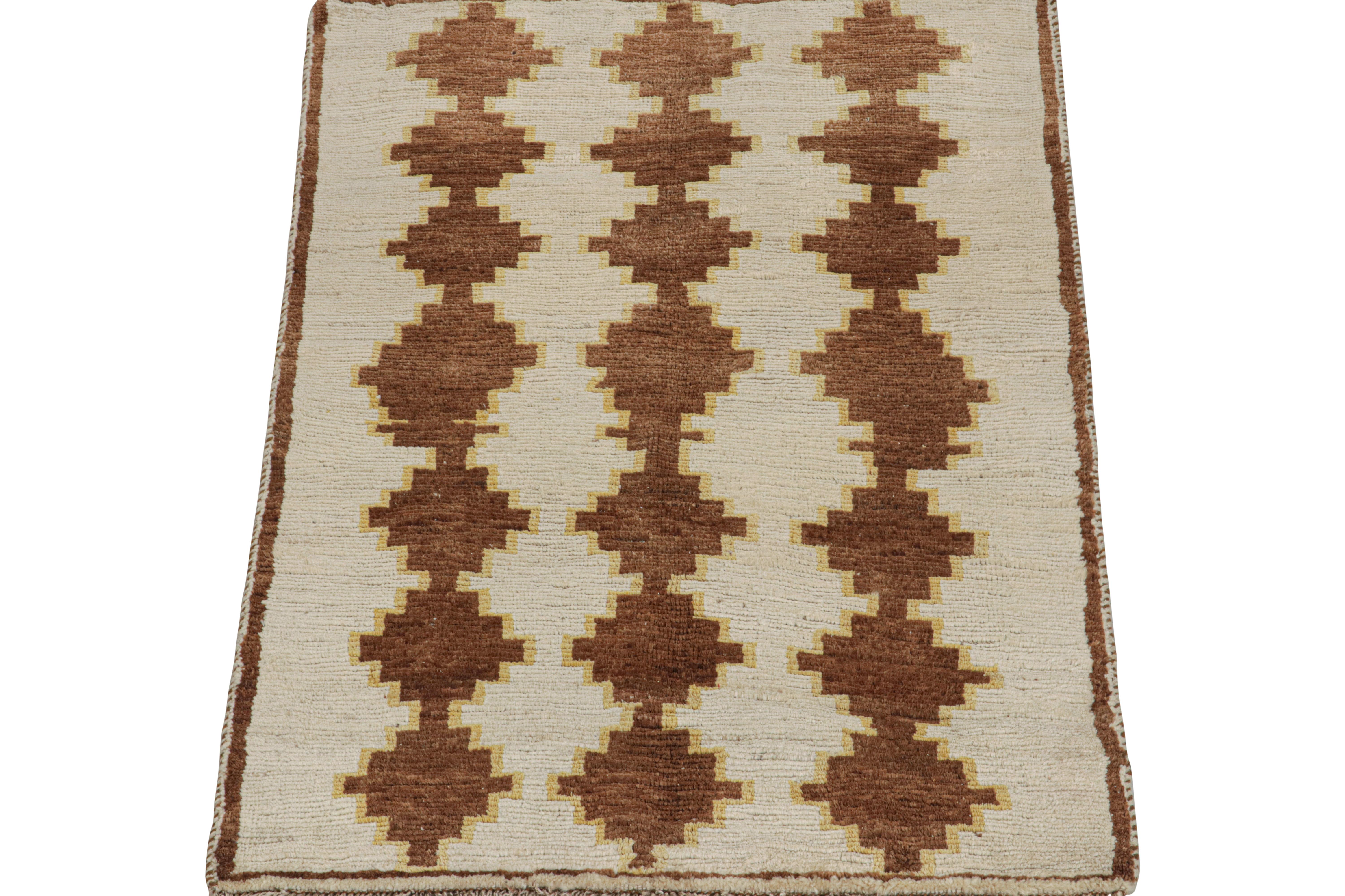 This vintage 4x6 Persian rug is a Gabbeh rug that originates from the Qashqai tribe—hand-knotted in wool circa 1950-1960.

Its geometric pattern enjoys a play of beige and brown geometric patterns with fine yellow accents. 

Connoisseurs will