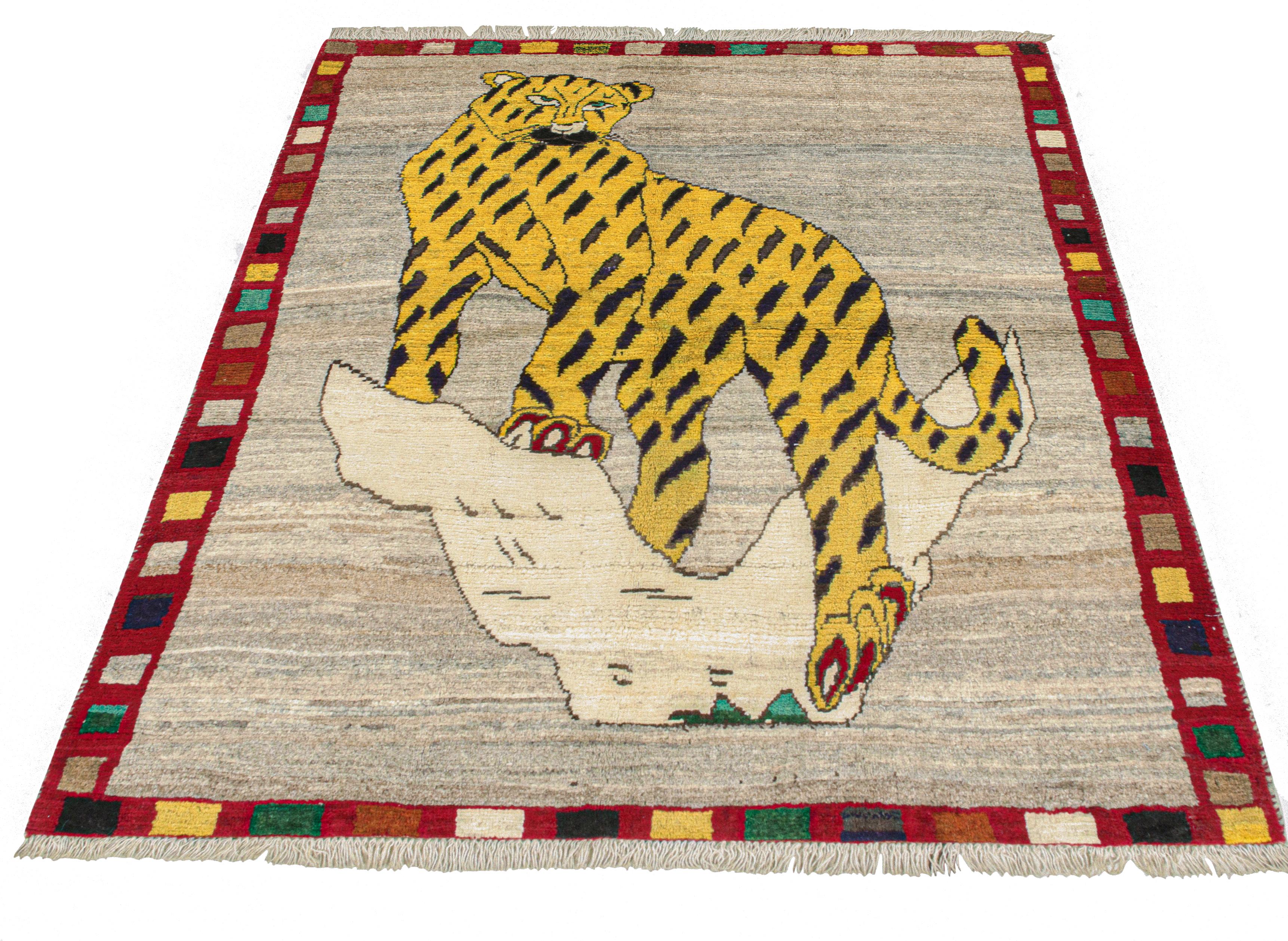 This vintage 5x6 Persian rug is a rare midcentury Gabbeh piece that originates from the Qashqai tribe. Hand-knotted in wool circa 1950-1960, its design is a pictorial that resembles a leopard, or possibly a jaguar. 

The design is a daring,