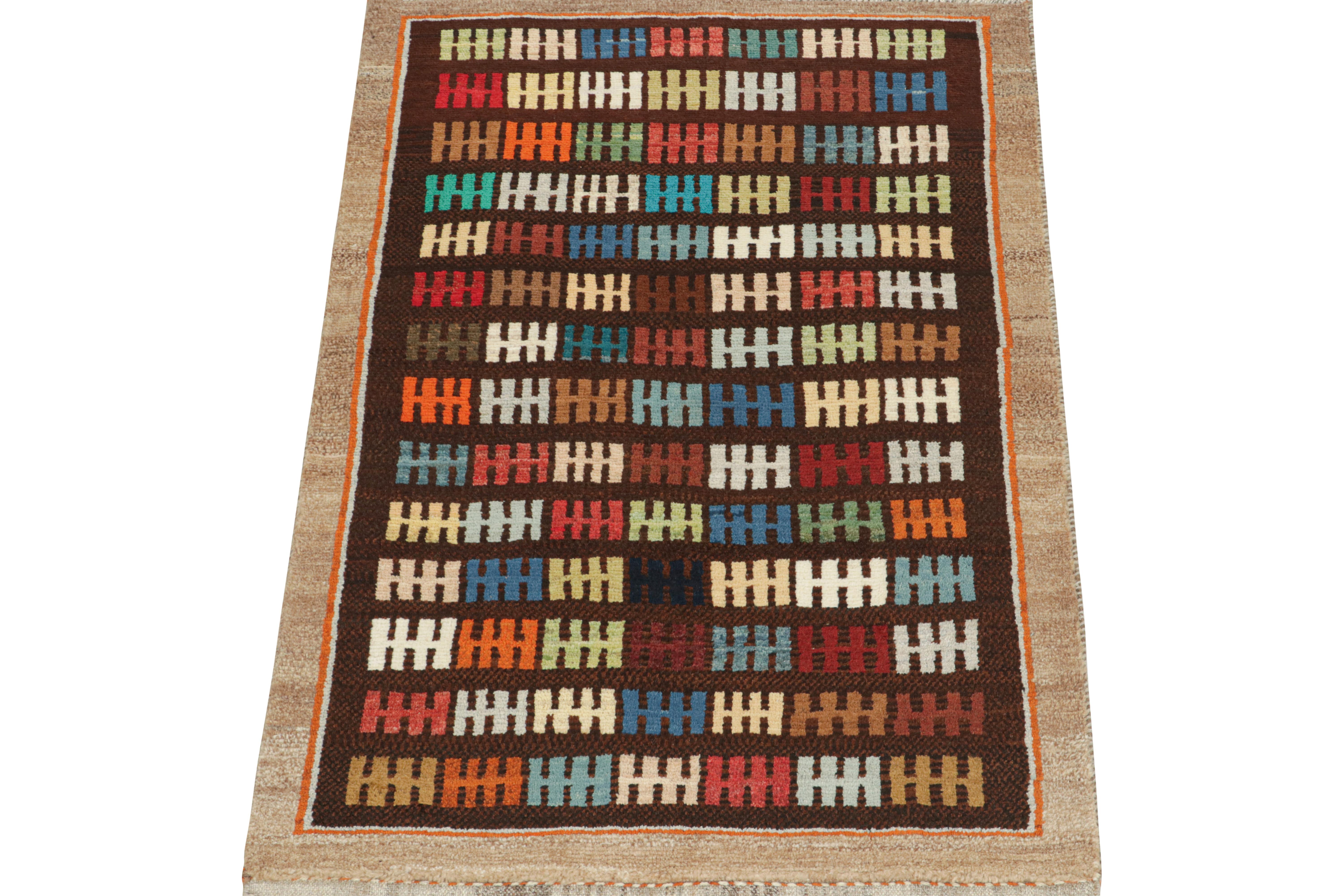 This vintage 3x5 Persian rug is a Gabbeh rug that originates from the Qashqai tribe—hand-knotted in wool circa 1950-1960.

Its repeat hosts a geometric pattern in vibrant colors atop a rich brown field and beige border. Though polychromatic, its