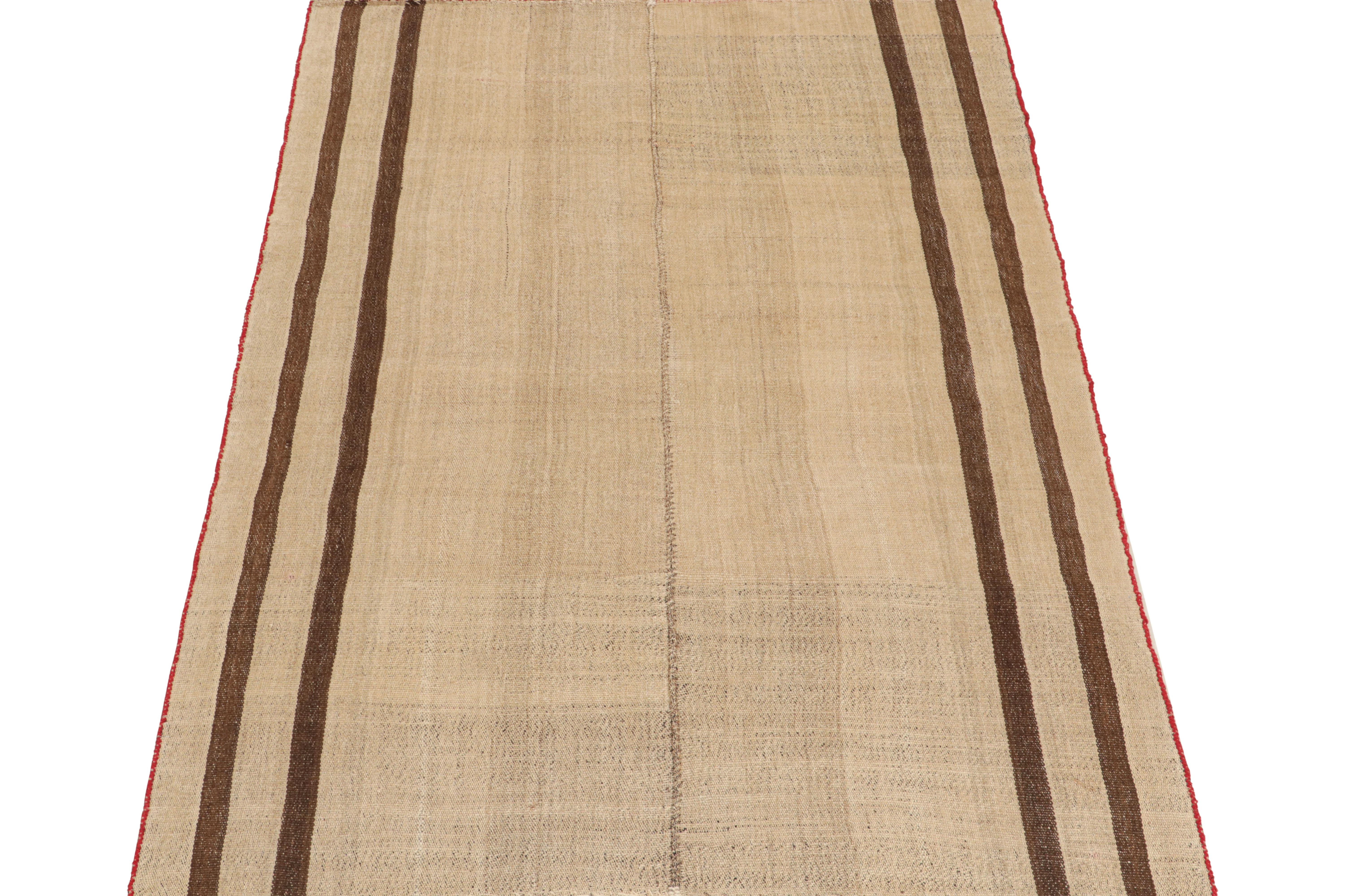 This vintage 6x8 Persian kilim is a mid-century Qashqai tribal rug, handwoven in wool circa 1950-1960.

This type of Kilim remarks a Jajim-style flat weave, in which tribal weavers would combine smaller pieces into one. The design enjoys a beige