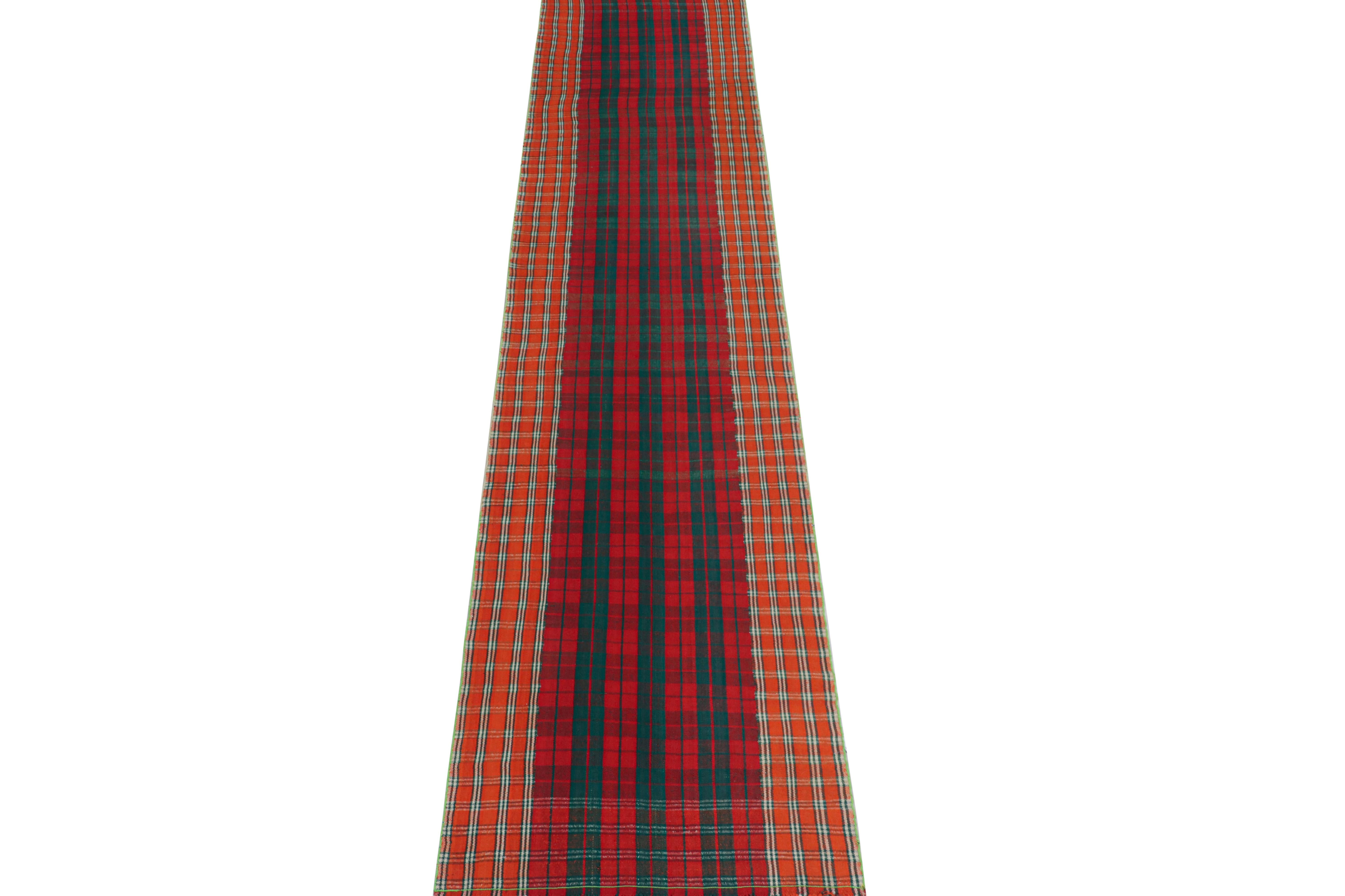 This vintage 3x15 Persian kilim is a rare extra-long runner from the Qashqai tribe, handwoven in wool circa 1950-1960.

Its technique is a mid-century Jajim Kilim style, in which tribal weavers would combine multiple narrow flat weaves together.