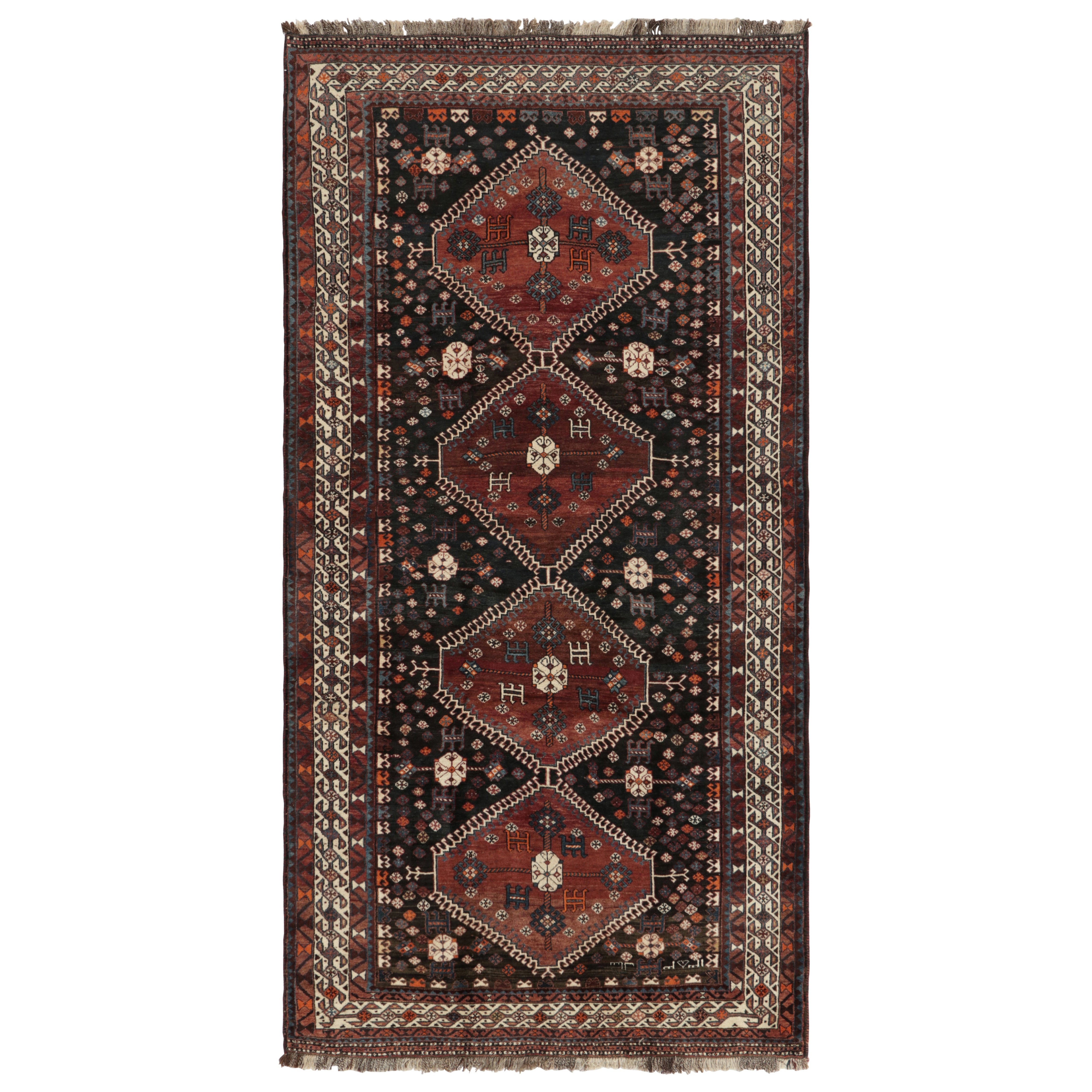 Tappeto persiano vintage Qashqai nero con medaglioni - Rug & Kilim in vendita