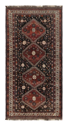Alfombra persa vintage Qashqai negra con medallones - Rug & Kilim