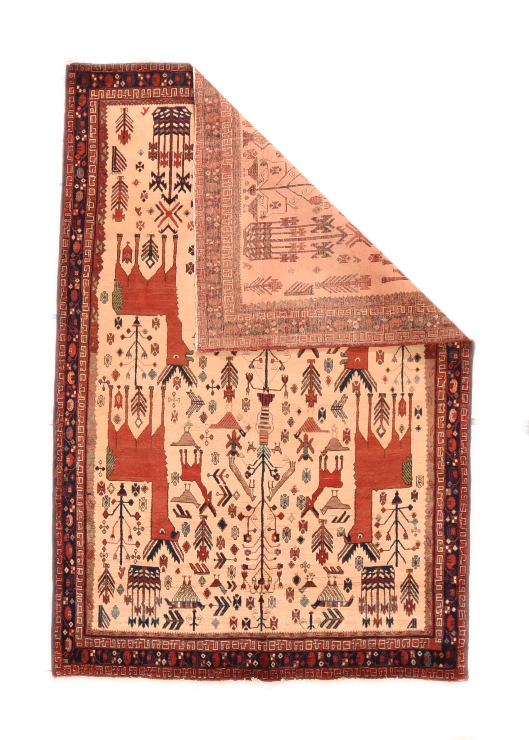 Vintage Qashqai rug 5'9'' x 8'3''. The straw-sand cream field displays four large, rust quadrupeds with short, serrated horns, with smaller en suite animals, numerous birds, and spindly flowers, all across the central pole with intermittent vases.