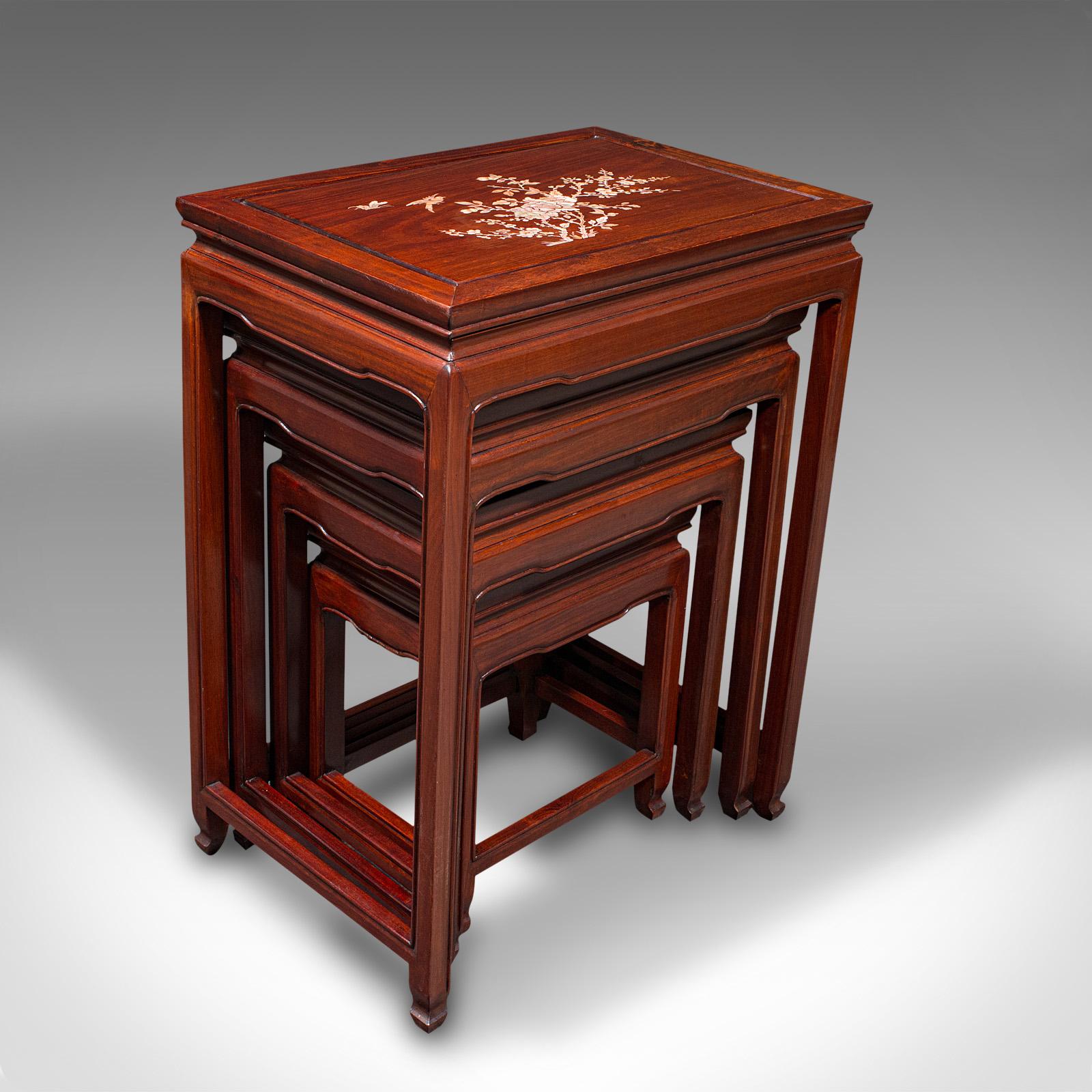 This is a vintage quartetto of nest tables. A Chinese, rosewood graduated occasional table with Mother of Pearl inlay, dating to the mid 20th century, circa 1950.

Delightfully presented nesting tables, with great colour and finish
Displaying a