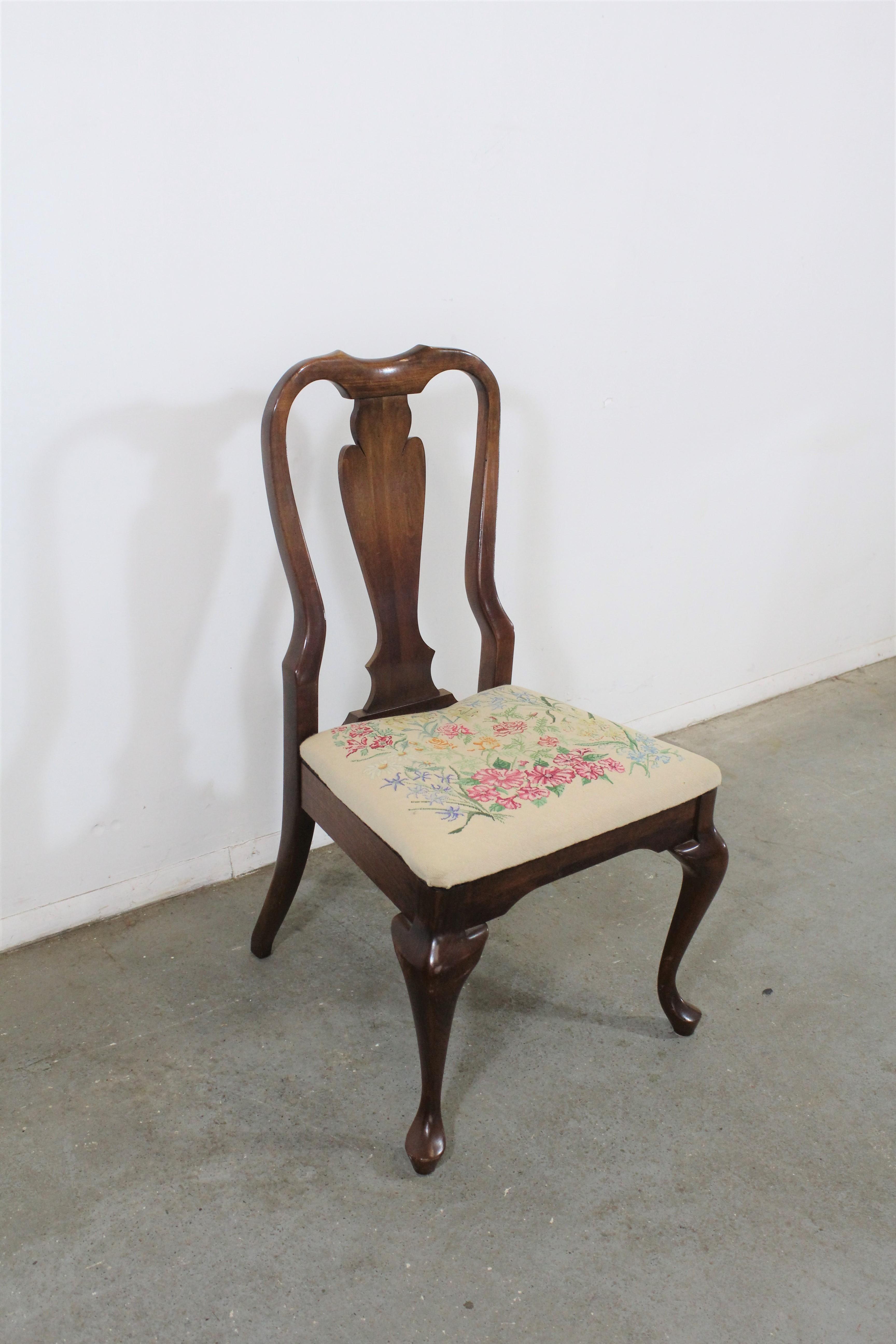 Pair of vintage Queen Anne cherry arm dining chairs

Offered is a vintage Queen Anne side chair. It's made of solid cherry wood and has an adorable stitched floral upholstered seat. In very good condition for its age, with some slight surface