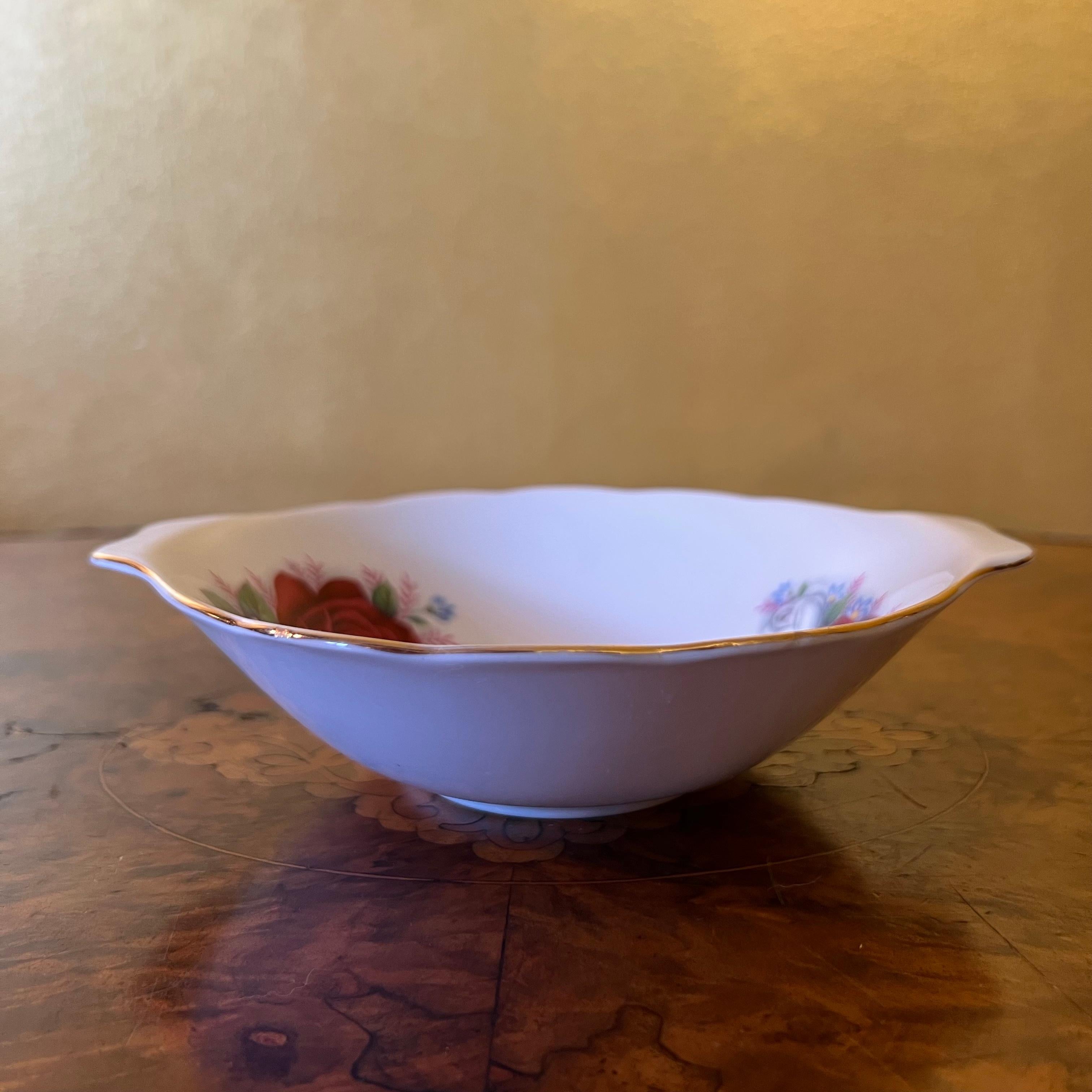 Description: Red and white rose print with gold trimming, some ware to item, stamped Queen Anne

Circa: 1960s

Material: Porcelain

Country Of Origin: England

Measurements: 3.5cm high, 17.5cm length, 15cm width  

Postage via Australia Post with