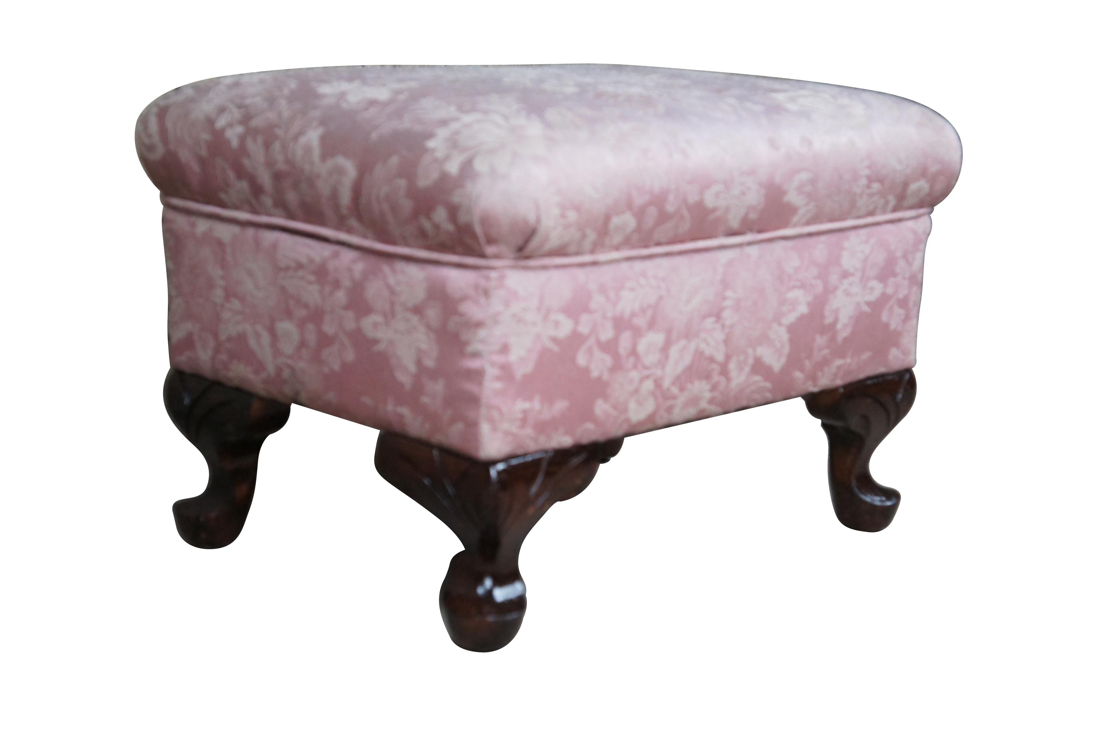 Mid 20th Century footstool with floral upholstered seat.  Features a rectangular form with short carved cabriole legs. 

Dimensions:
15