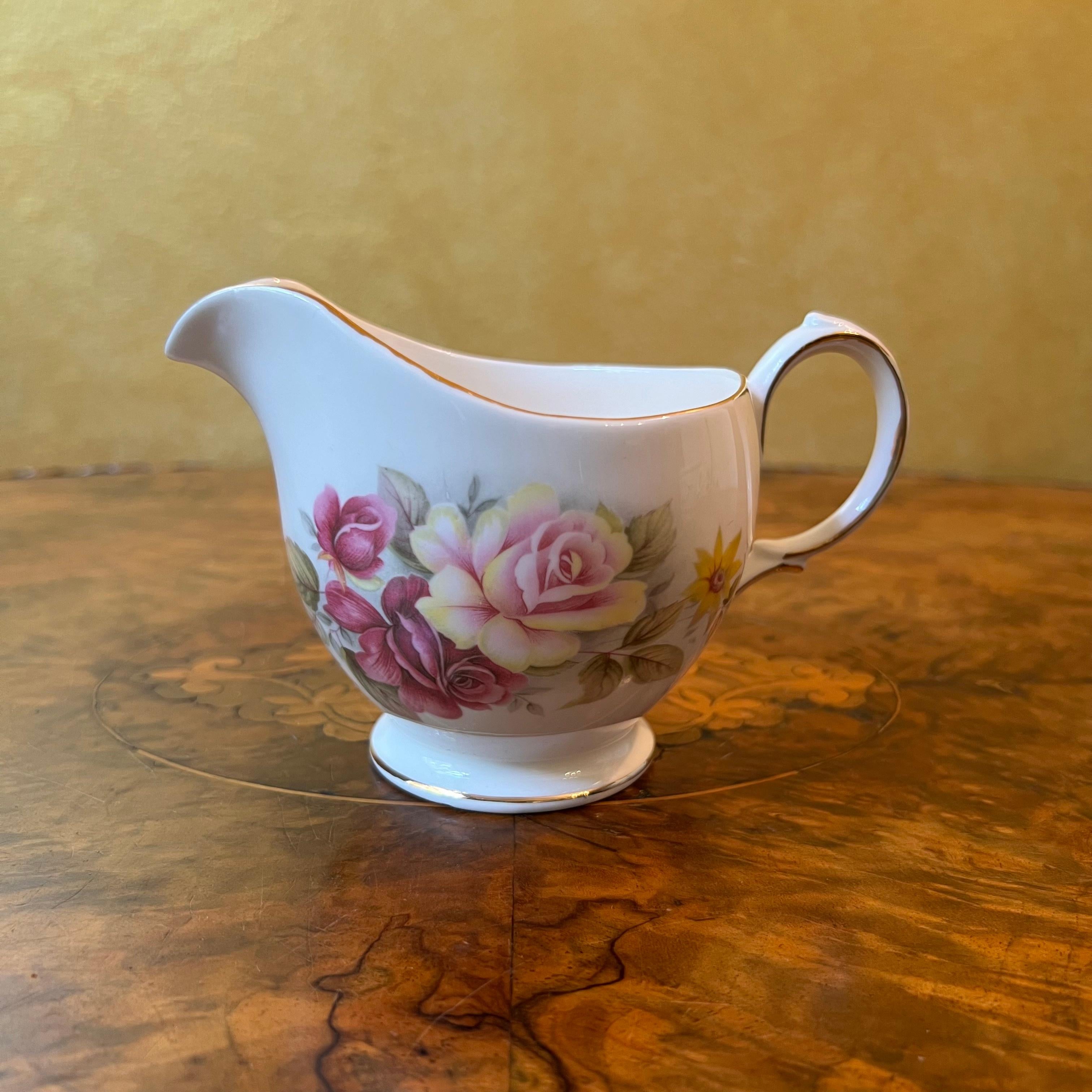 Description: Pink and yellow rose print with gold trim, some wear to gold trim, stamped Queen Anne

Circa: 1960s

Material: Bone China 

Measurements: 8.5cm high, 14cm length, 8.5cm width 

Country Of Origin: England 

Postage via Australia Post